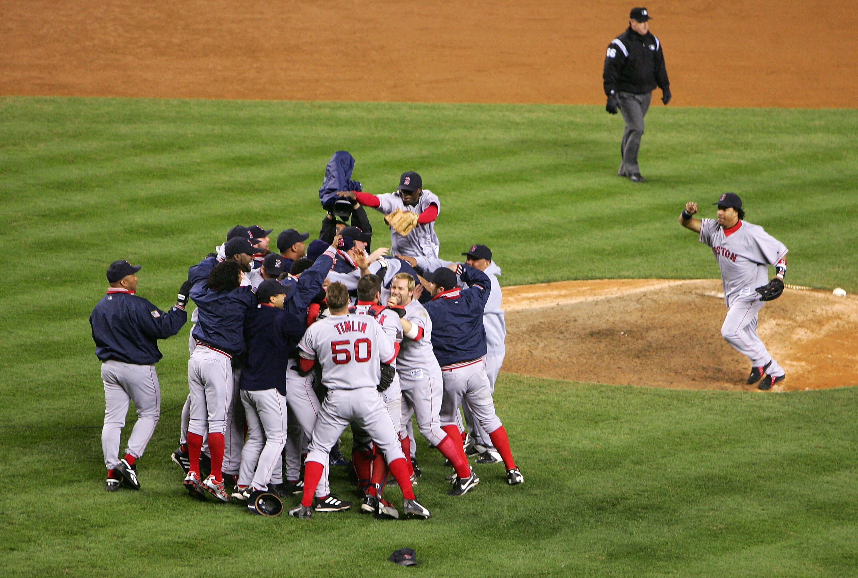 NEW YORK - OCTOBER 20:  The Boston Red Sox celebrate after defeating the New York Yankees 10-3 to win game seven of the American League Championship Series on October 20, 2004 at Yankee Stadium in the Bronx borough of New York City. (Photo by Ezra Shaw/Ge