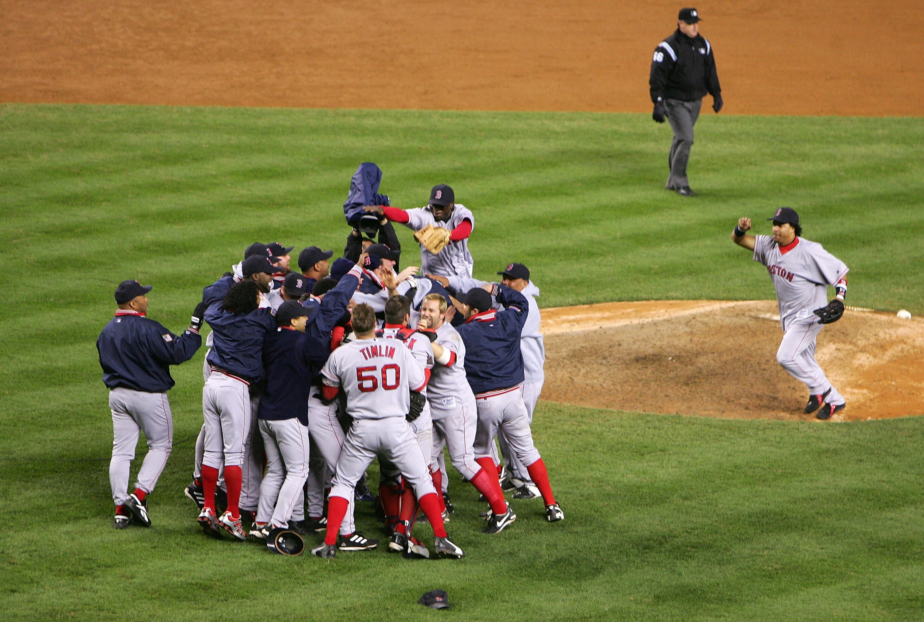 NEW YORK - OCTOBER 20: The Boston Red Sox celebrate after defeating the New York Yankees 10-3 to win game seven of the American League Championship Series on October 20, 2004 at Yankee Stadium in the Bronx borough of New York City. (Photo by Ezra Shaw/Ge NEW YORK - OCTOBER 20: The Boston Red Sox celebrate after defeating the New York Yankees 10-3 to win game seven of the American League Championship Series on October 20, 2004 at Yankee Stadium in the Bronx borough of New York City. (Photo by Ezra Shaw/Ge