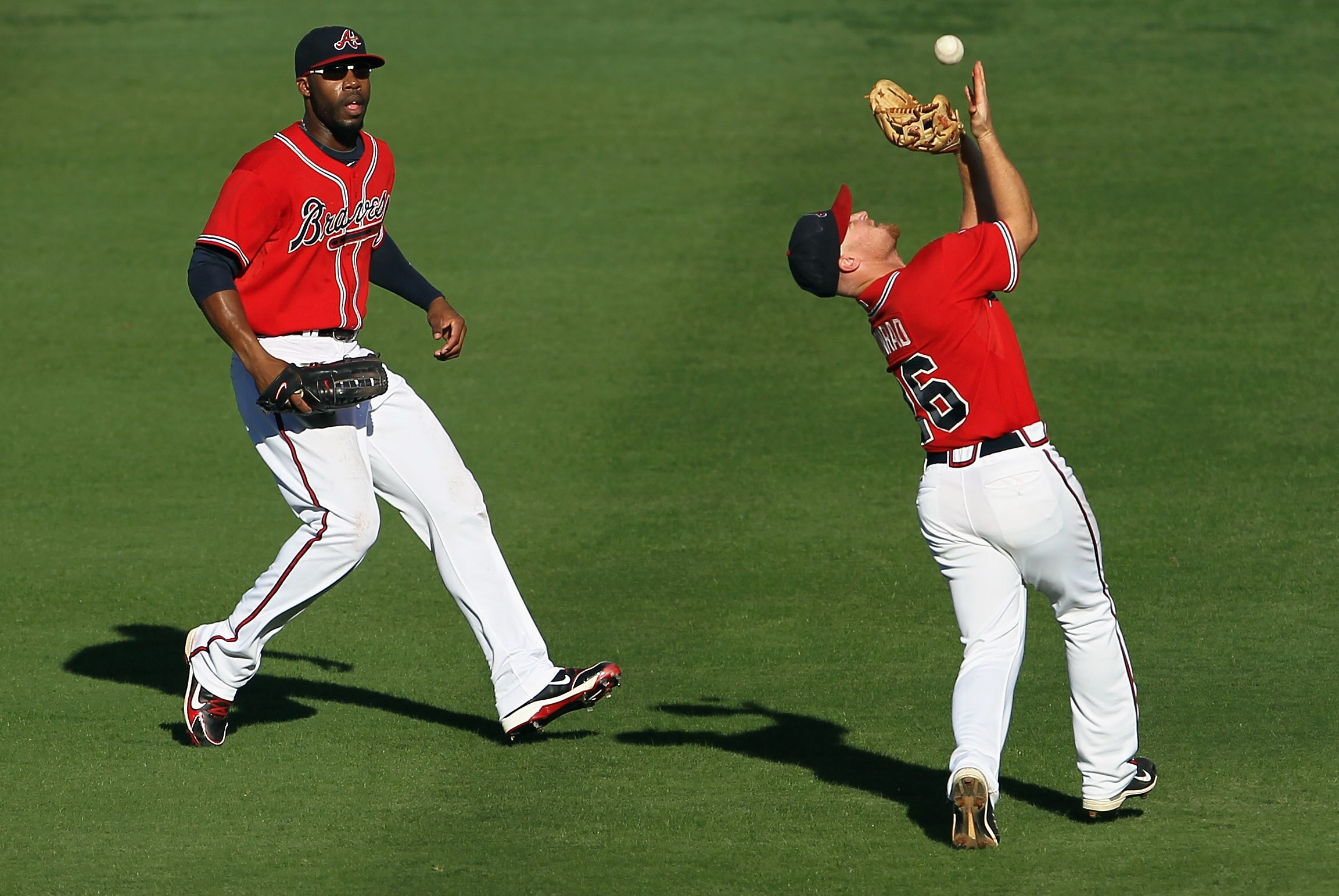 ATLANTA - OCTOBER 10:  Brooks Conrad #26 of the Atlanta Braves bobbles a pop fly during Game Three of the NLDS of the 2010 MLB Playoffs against the San Francisco Giants on October 10, 2010 at Turner Field in Atlanta, Georgia.  (Photo by Jamie Squire/Getty