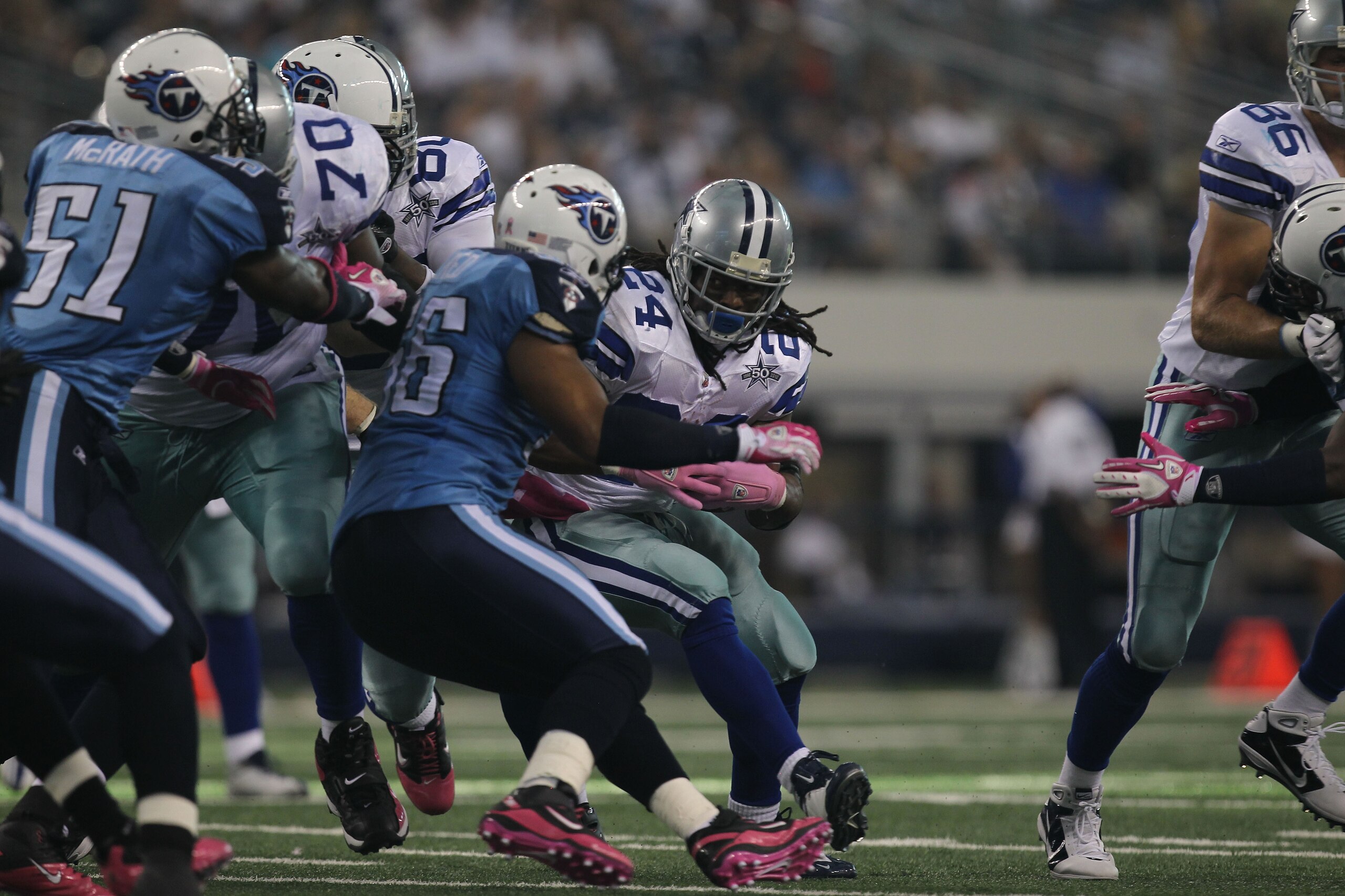 ARLINGTON, TX - OCTOBER 10:  Running back Marion Barber #24 of the Dallas Cowboys runs the ball against the Tennessee Titans at Cowboys Stadium on October 10, 2010 in Arlington, Texas.  (Photo by Ronald Martinez/Getty Images)