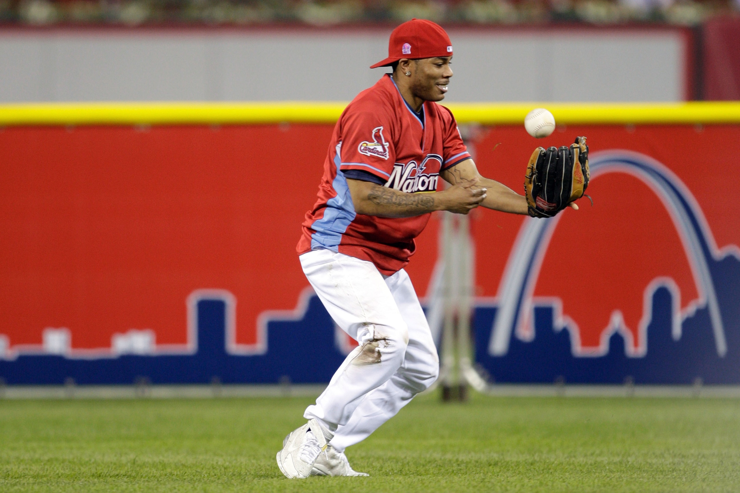 ST LOUIS, MO - JULY 12:  Rapper Nelly takes part in the Taco Bell All-Star Legends & Celebrity Softball Game at Busch Stadium on July 12, 2009 in St. Louis, Missouri.  (Photo by Jamie Squire/Getty Images)