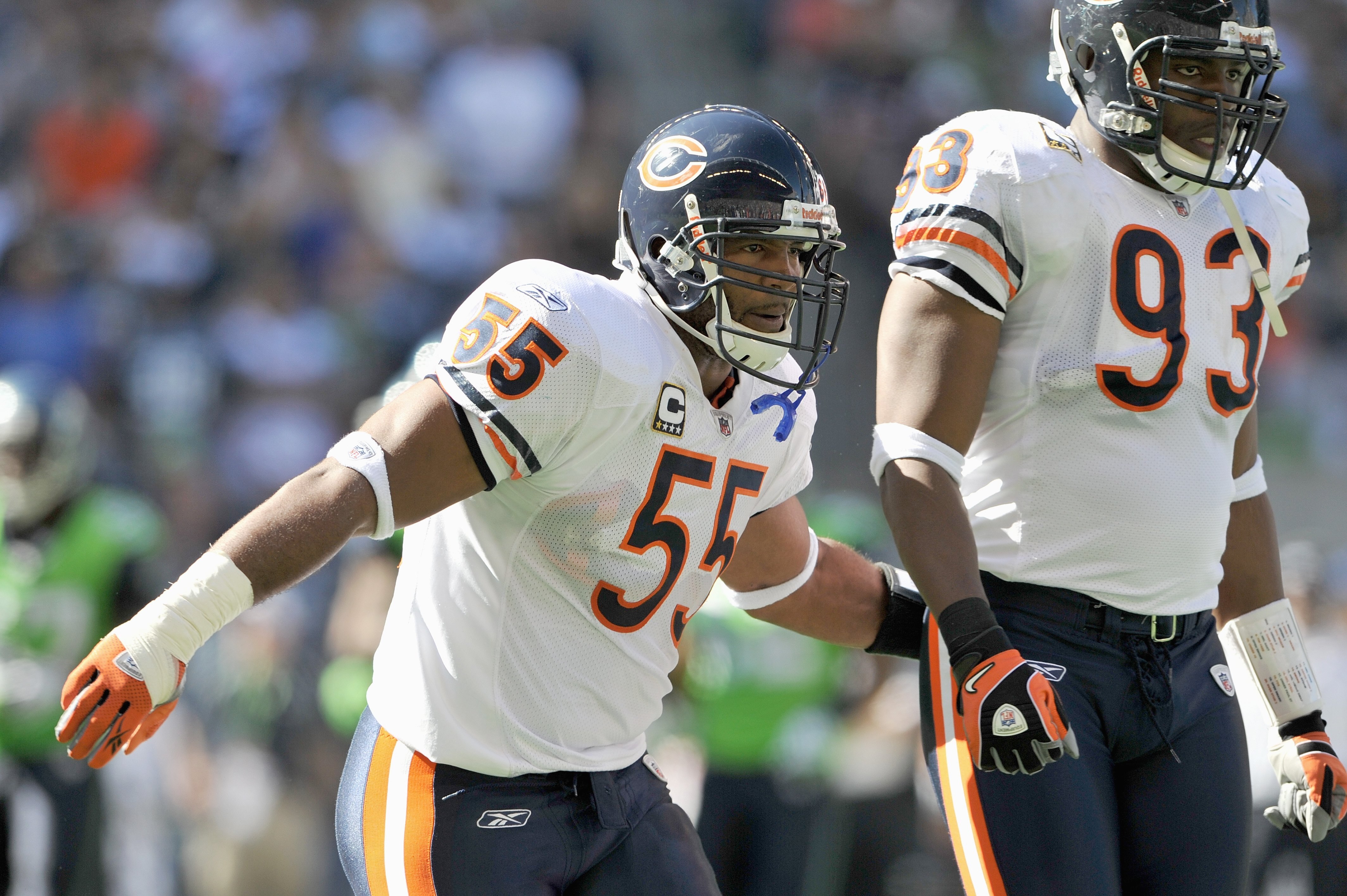 SEATTLE - SEPTEMBER 27: Lance Briggs #55 of the Chicago Bears moves on the field as Adewale Ogunleye #93 looks on during the game against the Seattle Seahawks on September 27, 2009 at Qwest Field in Seattle, Washington. The Bears defeated the Seahawks 25-