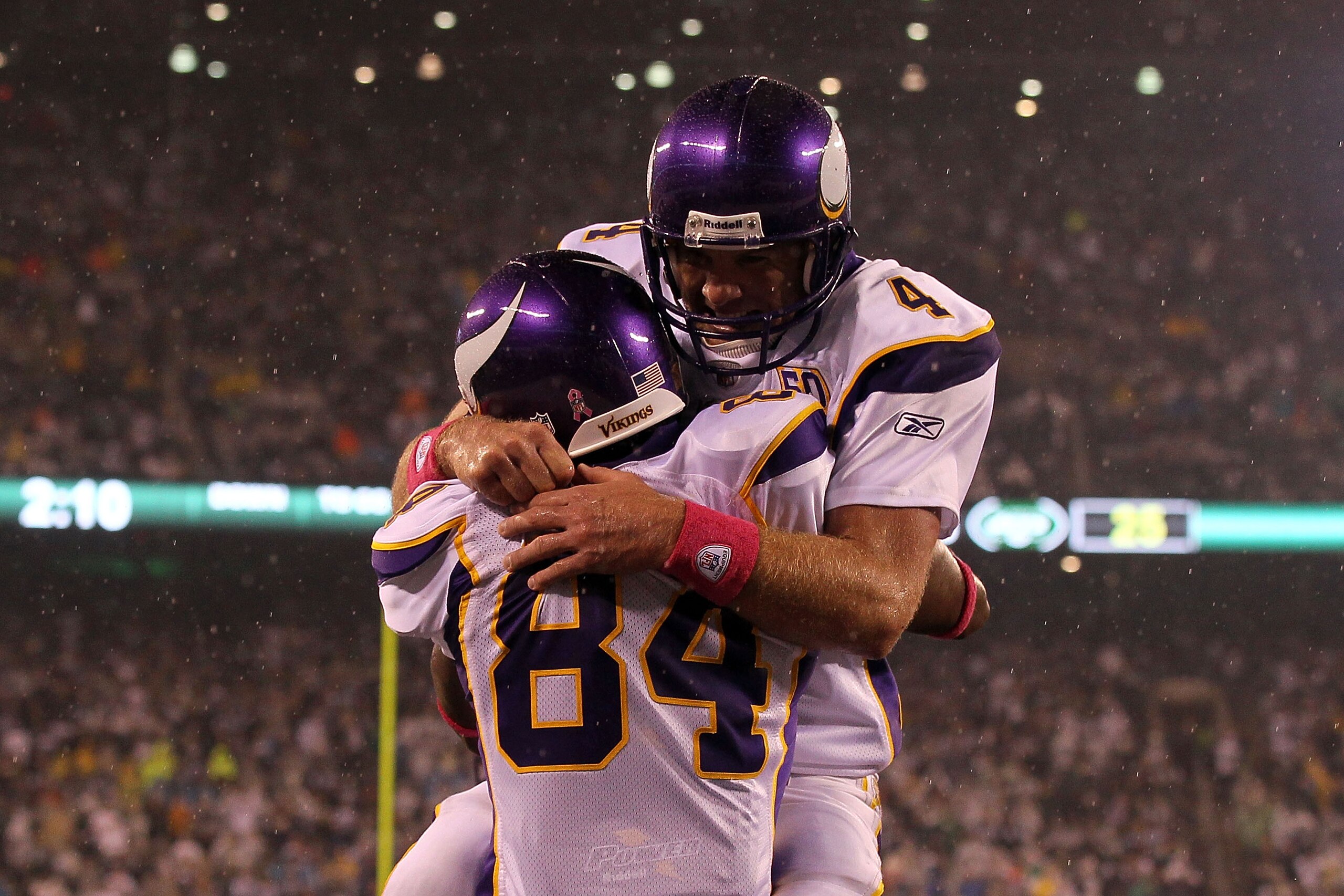 EAST RUTHERFORD, NJ - OCTOBER 11:  Brett Favre #4 and Randy Moss #84 of the Minnesota Vikings celebrate after Moss caught a 37-yard touchdown pass from Favre in the third quarter against the New York Jets at New Meadowlands Stadium on October 11, 2010 in