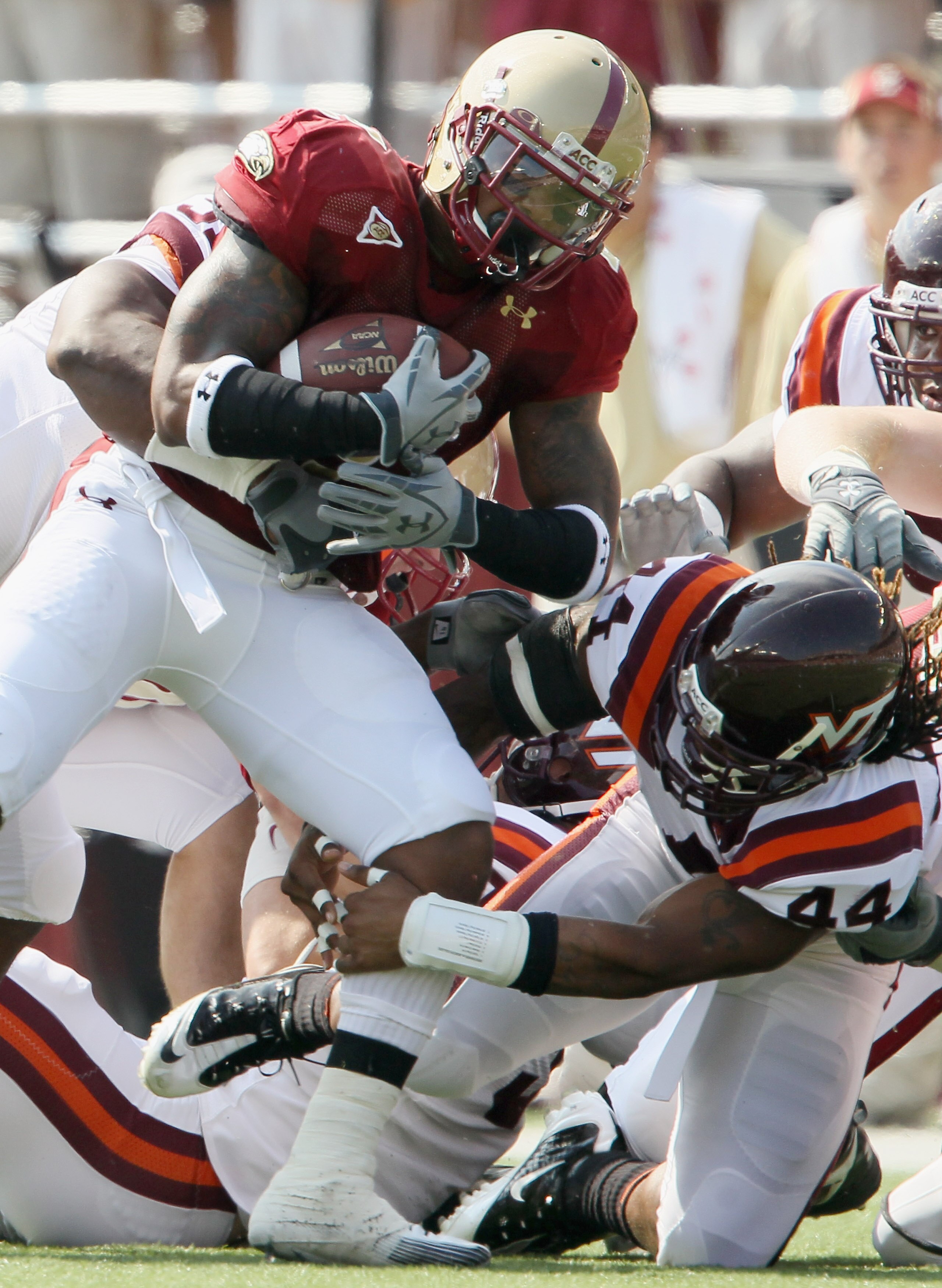 CHESTNUT HILL, MA - SEPTEMBER 25:  Montel Harris #2 of the Boston College Eagles is stopped by Lyndell Gibson #44 of the Virginia Tech Hokies on September 25, 2010 at Alumni Stadium in Chestnut Hill, Massachusetts.  (Photo by Elsa/Getty Images)
