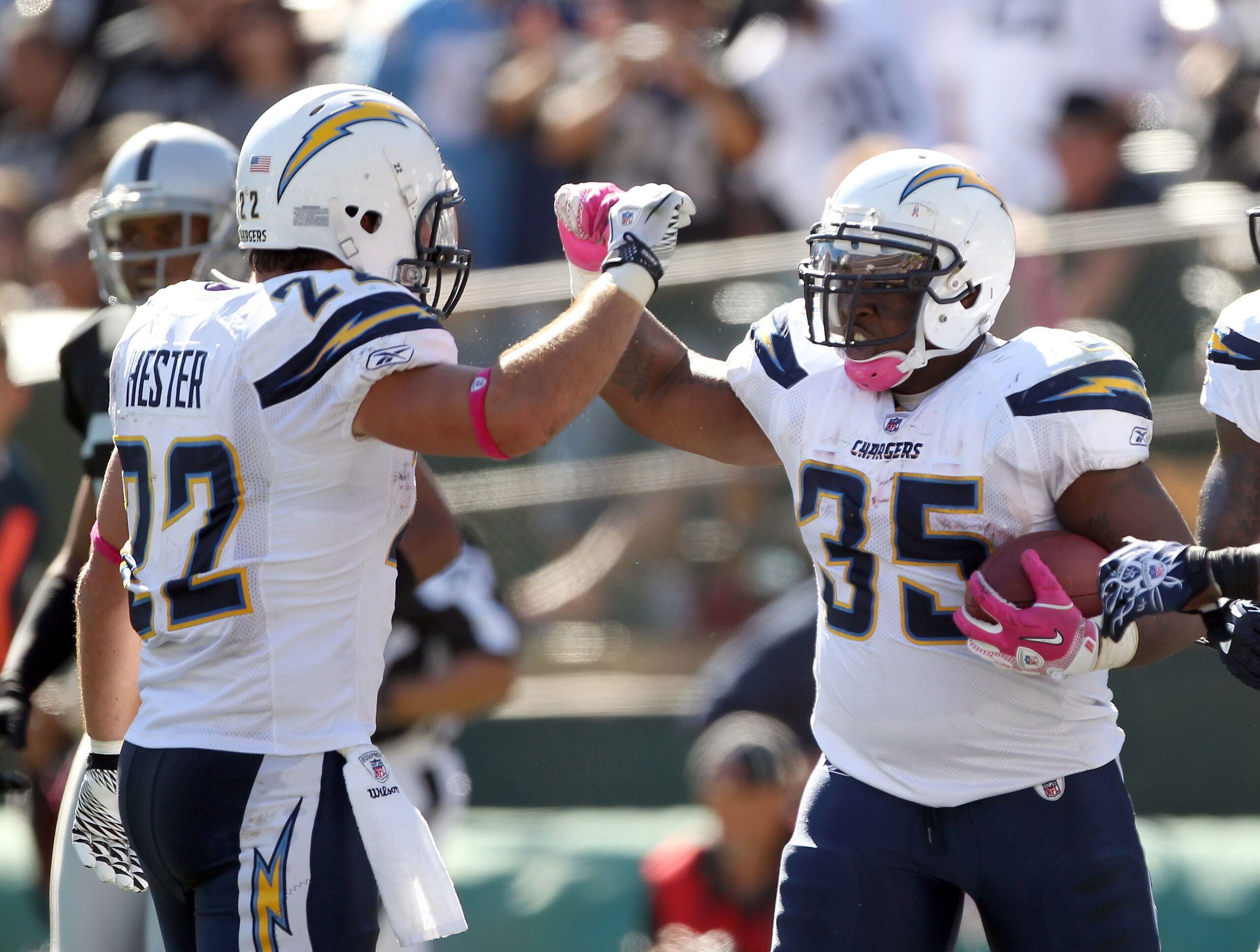OAKLAND, CA - OCTOBER 10:  Mike Tolbert #35 is congratulated by Jacob Hester #22 of the San Diego Chargers after he scored a touchdown against the Oakland Raiders at Oakland-Alameda County Coliseum on October 10, 2010 in Oakland, California.  (Photo by Ez