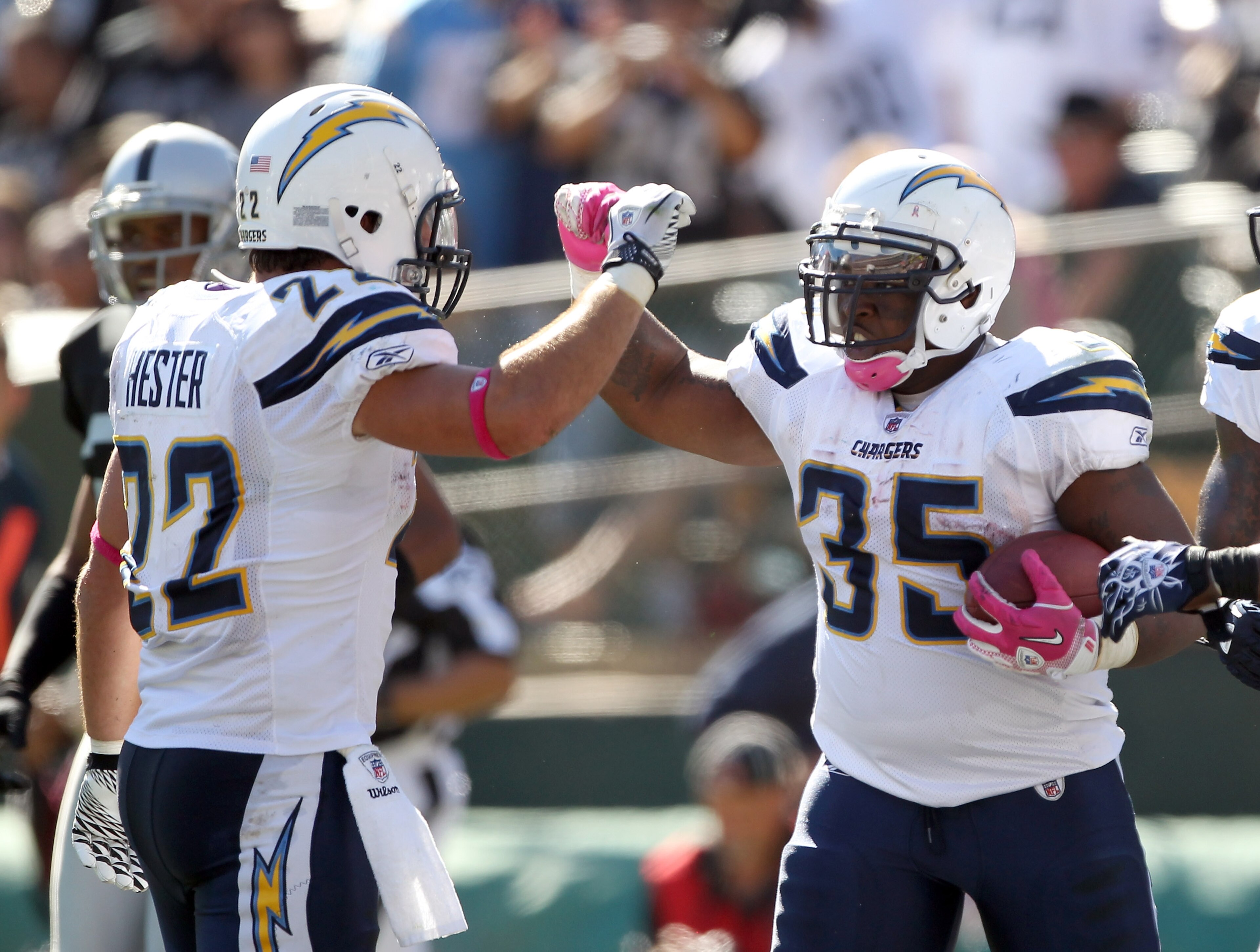 OAKLAND, CA - OCTOBER 10:  Mike Tolbert #35 is congratulated by Jacob Hester #22 of the San Diego Chargers after he scored a touchdown against the Oakland Raiders at Oakland-Alameda County Coliseum on October 10, 2010 in Oakland, California.  (Photo by Ez