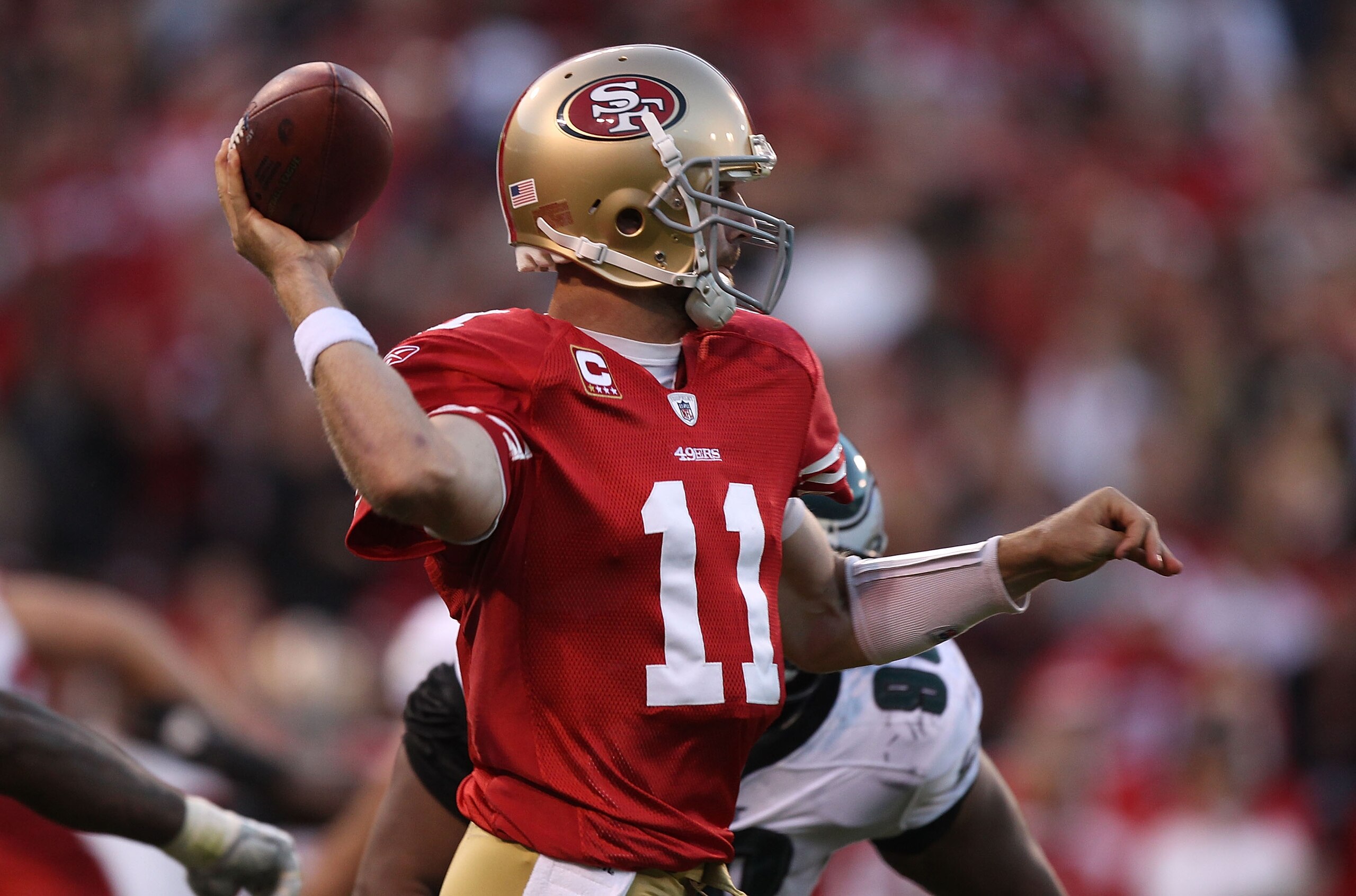 SAN FRANCISCO - OCTOBER 10:  Alex Smith #11 of the San Francisco 49ers passes against the Philadelphia Eagles during an NFL game at Candlestick Park on October 10, 2010 in San Francisco, California.  (Photo by Jed Jacobsohn/Getty Images)
