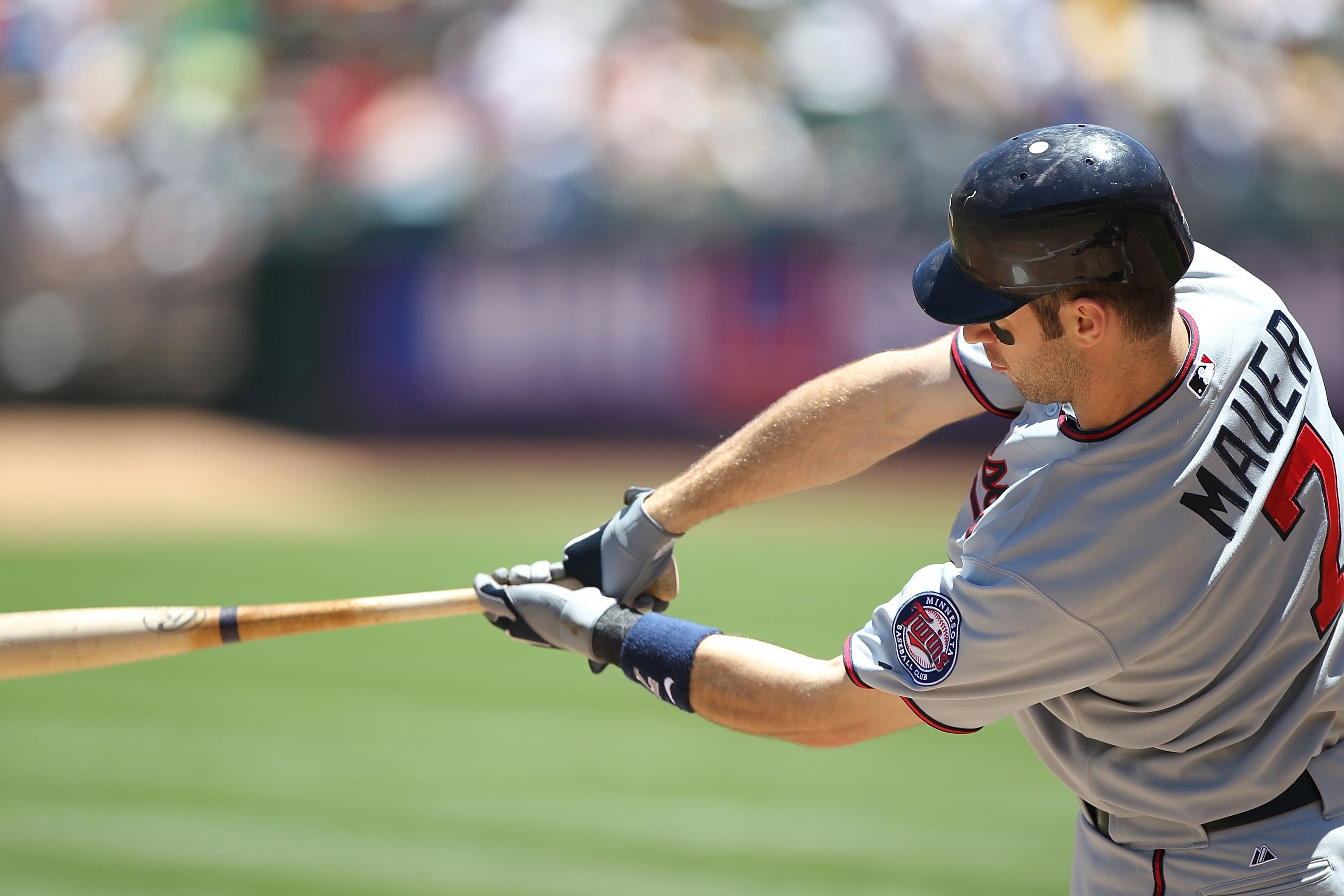 OAKLAND, CA - JUNE 06:  Joe Mauer #7 of the Minnesota Twins bats against the Oakland Athletics during an MLB game at the Oakland-Alameda County Coliseum on June 6, 2010 in Oakland, California.  (Photo by Jed Jacobsohn/Getty Images)