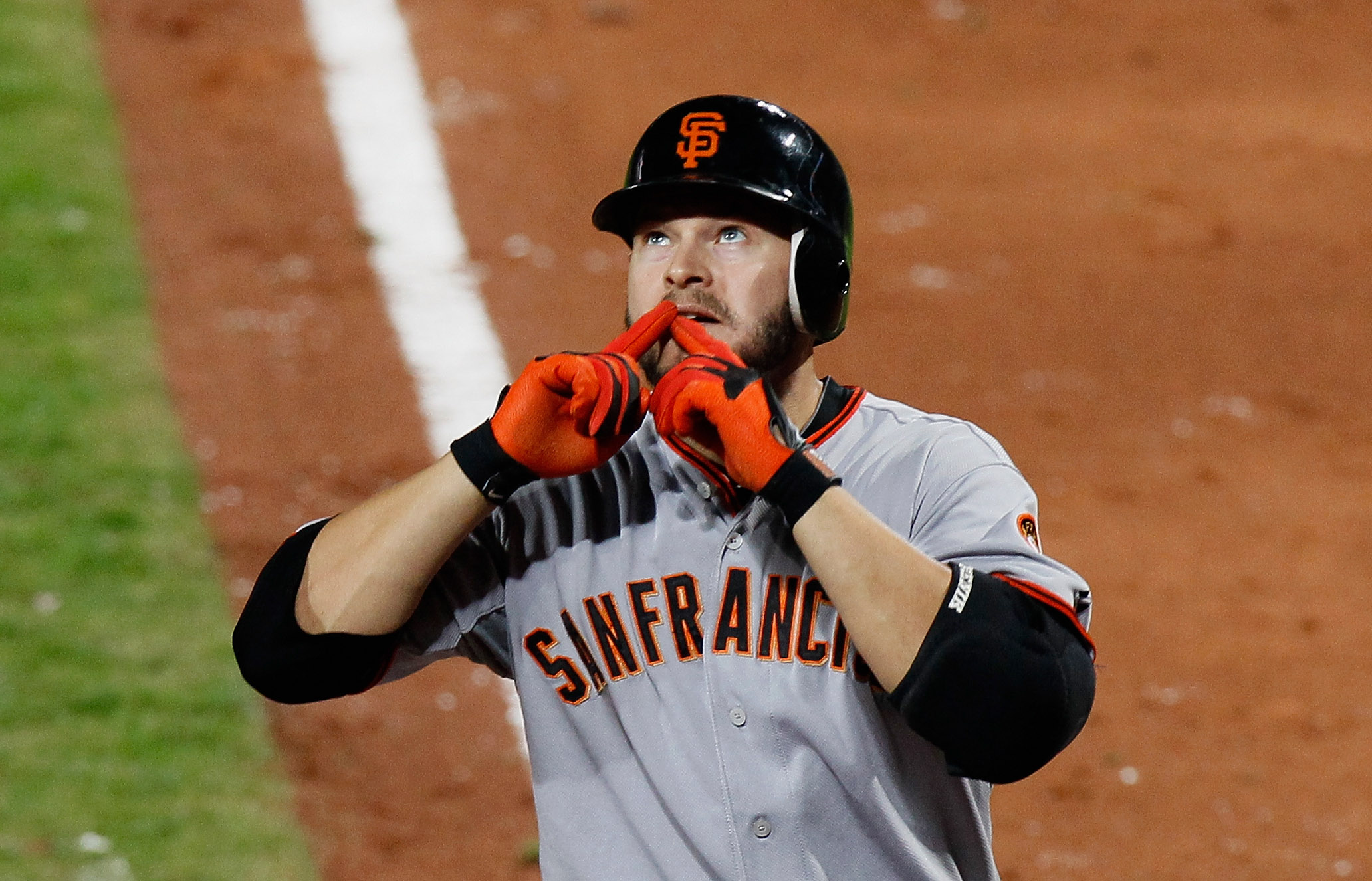 ATLANTA - OCTOBER 11:  Cody Ross #13 of the San Francisco Giants reacts after hitting a solo homer in the sixth inning against the Atlanta Braves during Game Four of the NLDS of the 2010 MLB Playoffs at Turner Field on October 11, 2010 in Atlanta, Georgia