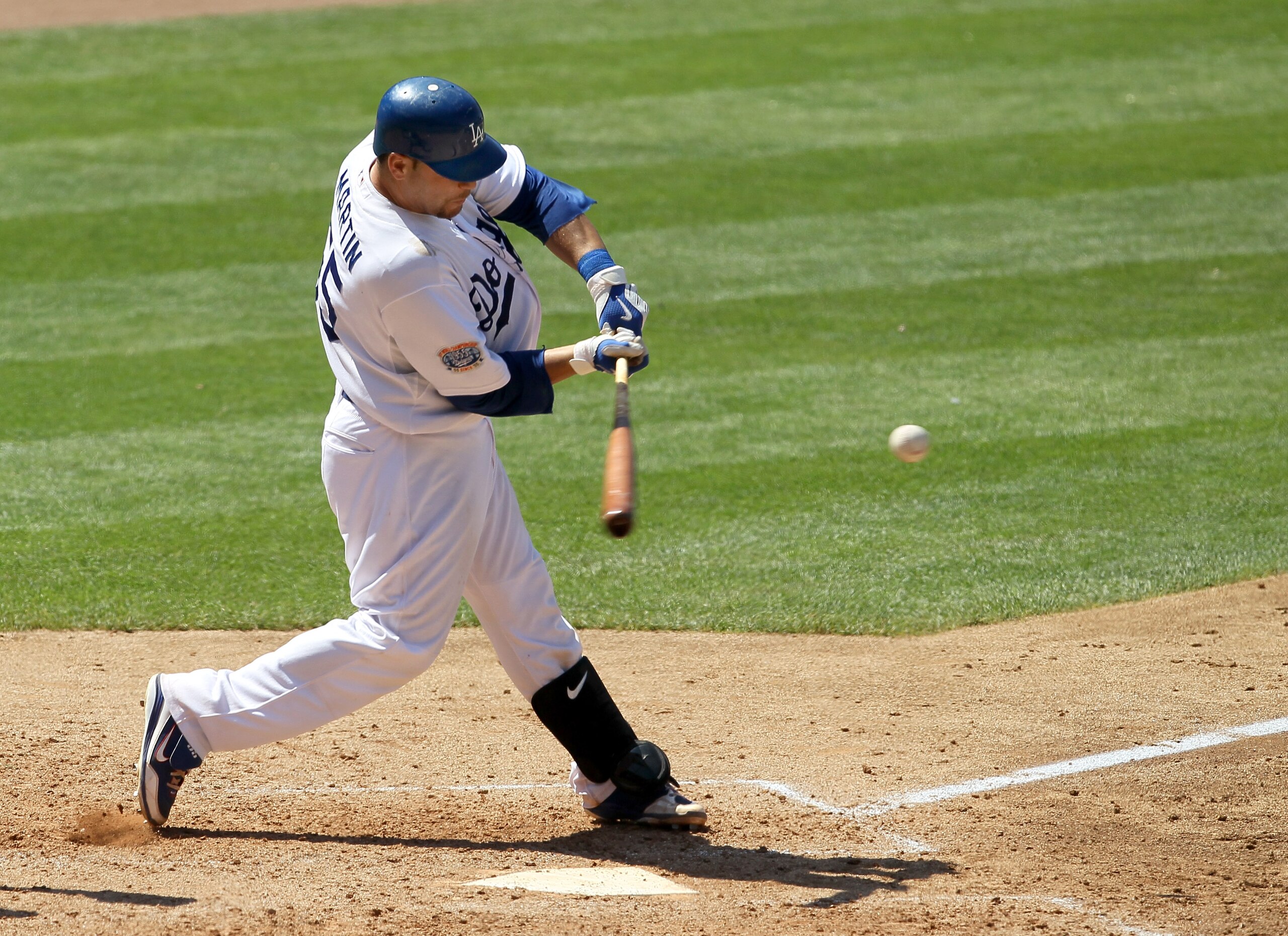 LOS ANGELES, CA - JULY 25:  Russell Martin #55 of the Los Angeles Dodgers hits an RBI double which accounts for the game's only run in the eighth nning against the New York Mets on July 25, 2010 at Dodger Stadium in Los Angeles, California.   The Dodgers 