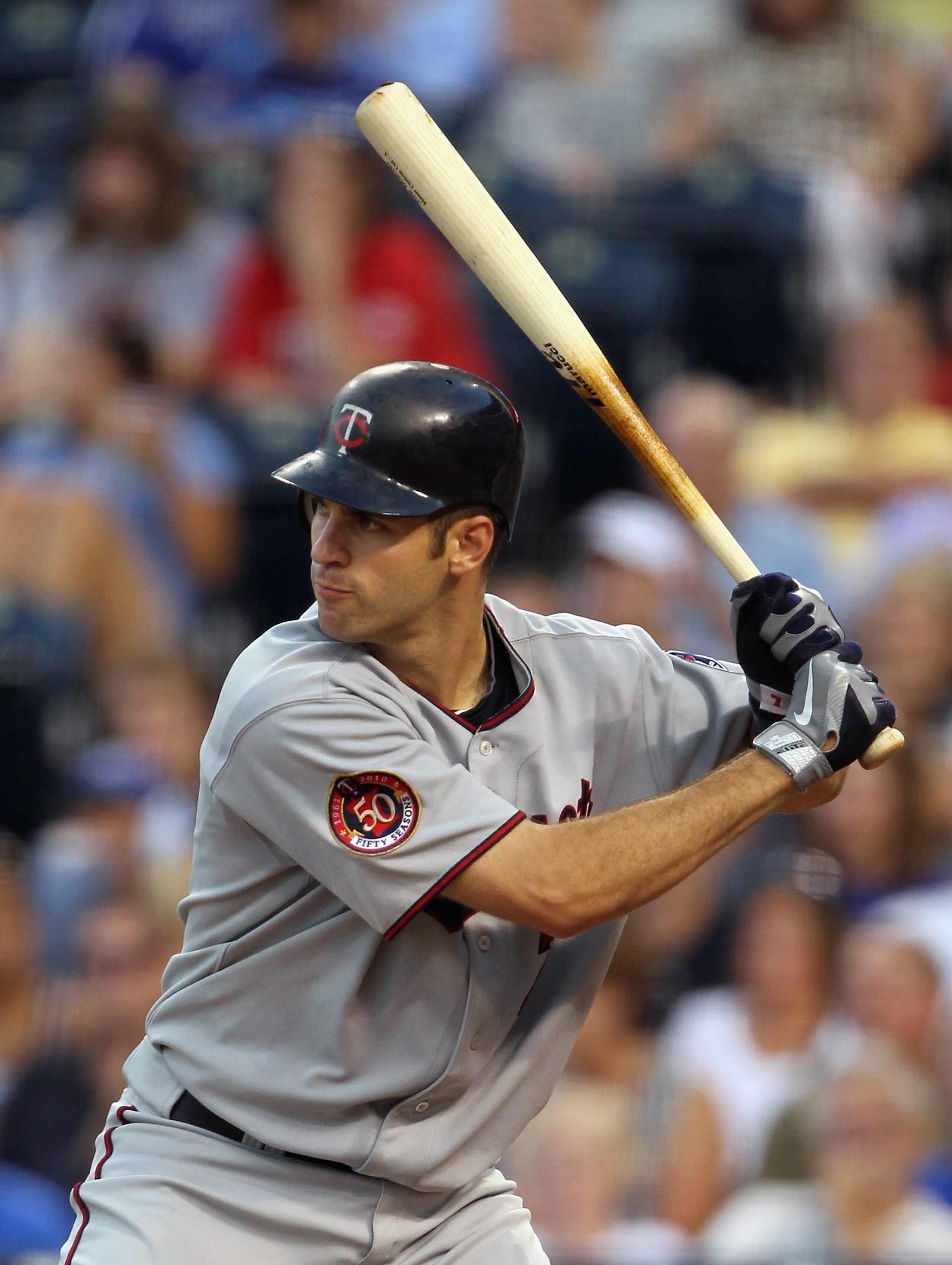 KANSAS CITY, MO - JULY 26:  Catcher Joe Mauer #7 of the Minnesota Twins bats during the game against the Kansas City Royals on July 26, 2010 at Kauffman Stadium in Kansas City, Missouri.  (Photo by Jamie Squire/Getty Images)
