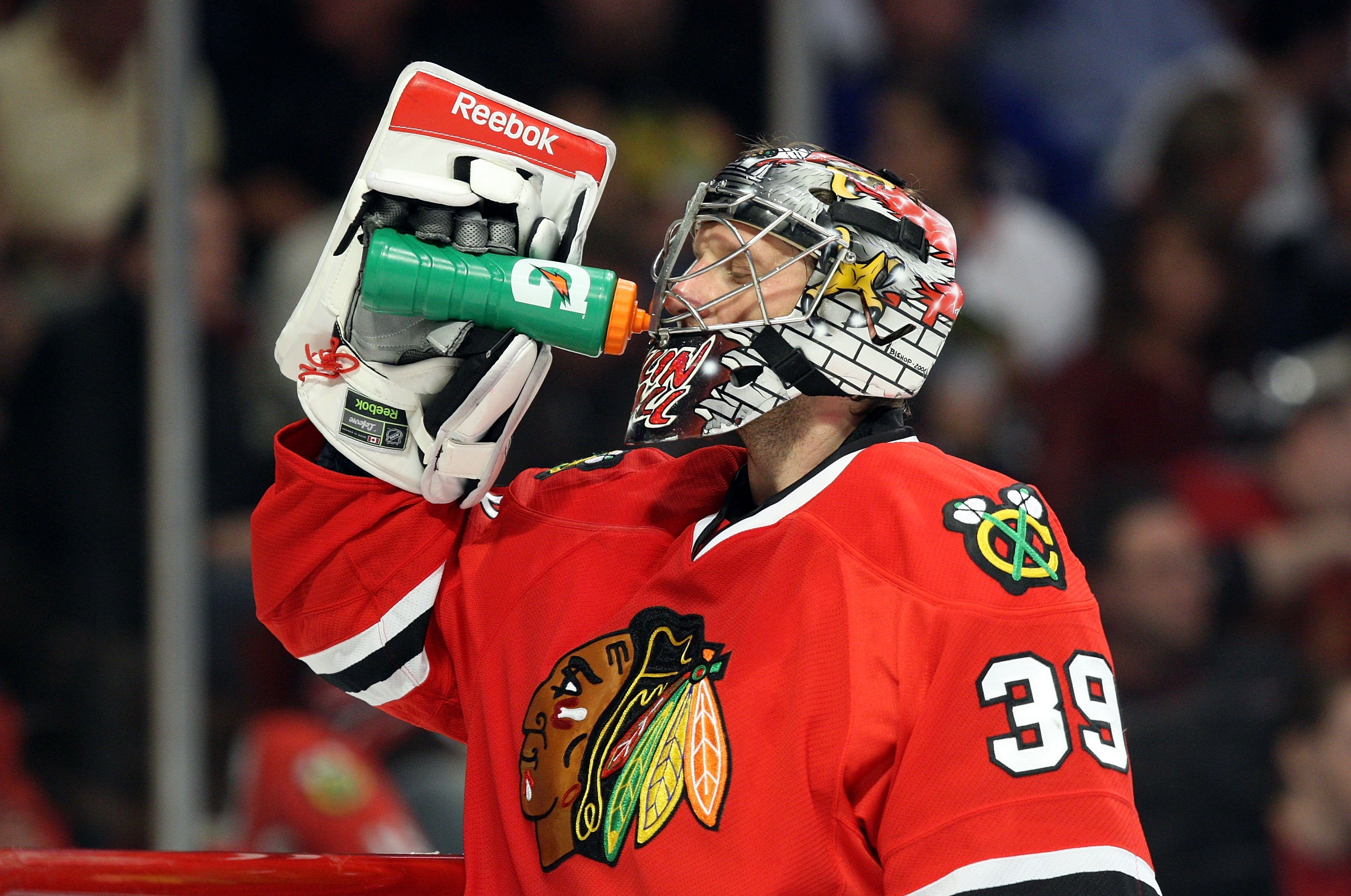 CHICAGO - MAY 22: Goalie Nikolai Khabibulin #39 of the Chicago Blackhawks takes a drink during a stop in play against the Detroit Red Wings during Game Three of the Western Conference Championship Round of the 2009 Stanley Cup Playoffs on May 22, 2009 at CHICAGO - MAY 22: Goalie Nikolai Khabibulin #39 of the Chicago Blackhawks takes a drink during a stop in play against the Detroit Red Wings during Game Three of the Western Conference Championship Round of the 2009 Stanley Cup Playoffs on May 22, 2009 at