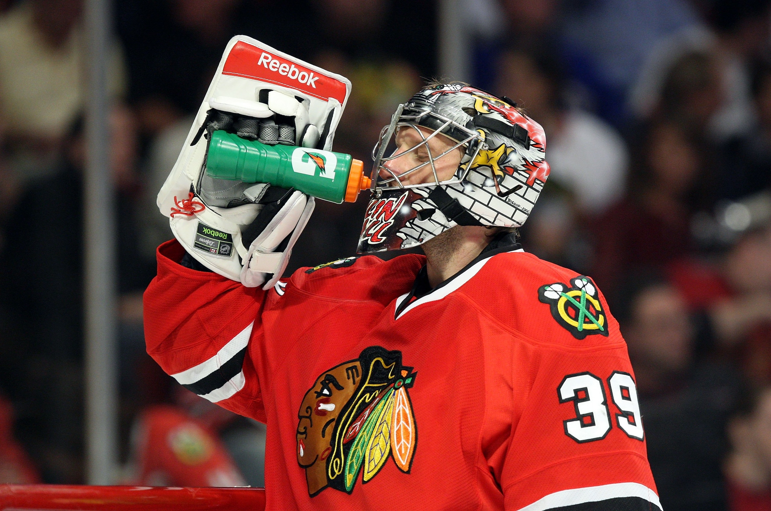 CHICAGO - MAY 22:  Goalie Nikolai Khabibulin #39 of the Chicago Blackhawks takes a drink during a stop in play against the Detroit Red Wings during Game Three of the Western Conference Championship Round of the 2009 Stanley Cup Playoffs on May 22, 2009 at
