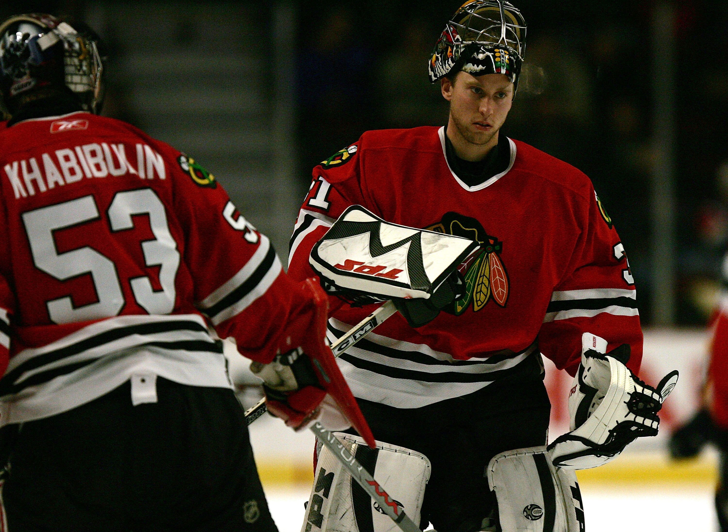 CHICAGO - DECEMBER 21: Goaltender Craig Anderson #31 of the Chicago Blackhawks replaces Nikolai Khabibulin #53 in the second period of a game against the Nashville Predators on December 21, 2005 at the United Center in Chicago, Illinois. The Predators de CHICAGO - DECEMBER 21: Goaltender Craig Anderson #31 of the Chicago Blackhawks replaces Nikolai Khabibulin #53 in the second period of a game against the Nashville Predators on December 21, 2005 at the United Center in Chicago, Illinois. The Predators de