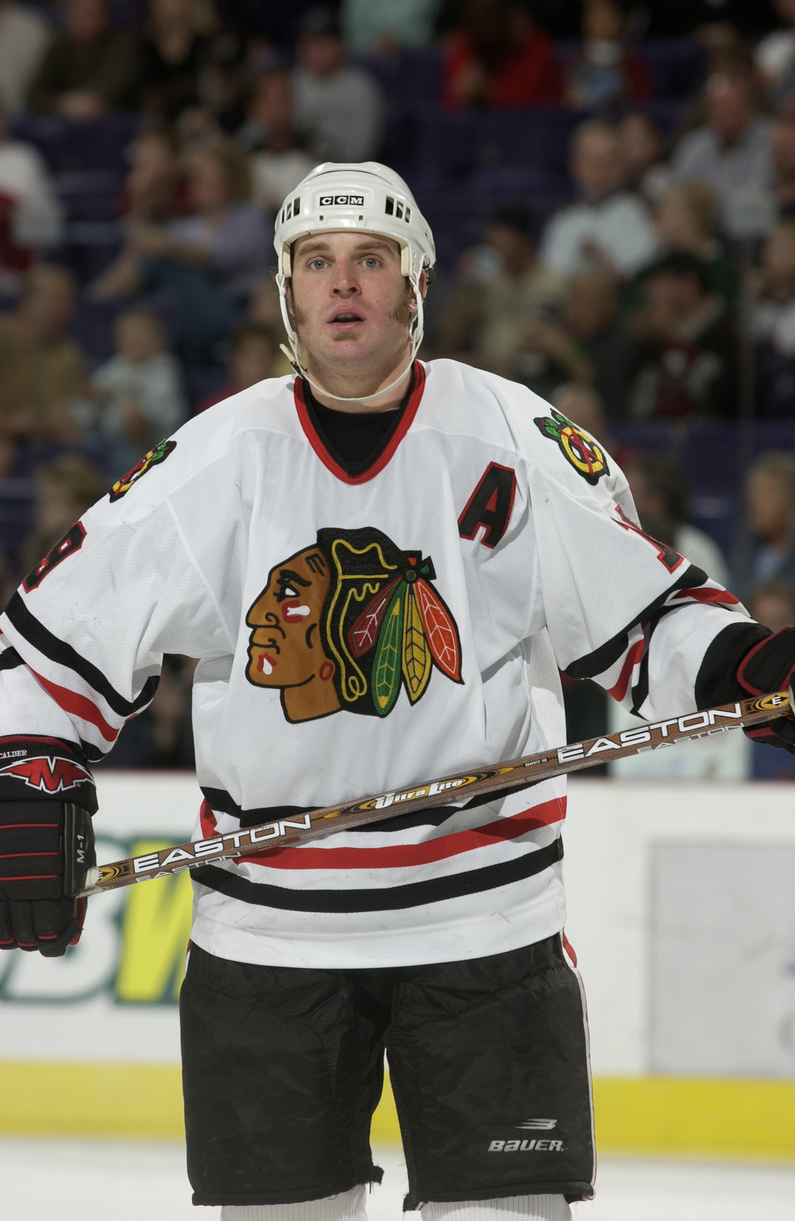 PHOENIX - OCTOBER 28:  Kyle Calder #19 of the Chicago Blackhawks looks on during a break in game action against the Phoenix Coyotes on October 28, 2003 at America West Arena in Phoenix, Arizona. The Blackhawks and Coyotes skated to a 2-2 tie.  (Photo by B