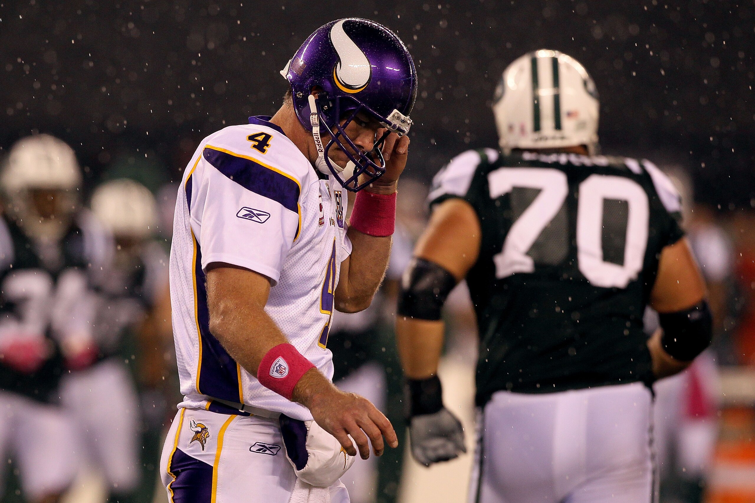 EAST RUTHERFORD, NJ - OCTOBER 11:  Quarterback Brett Favre #4 of the Minnesota Vikings walks back to the sideline against the New York Jets at New Meadowlands Stadium on October 11, 2010 in East Rutherford, New Jersey.  (Photo by Jim McIsaac/Getty Images)