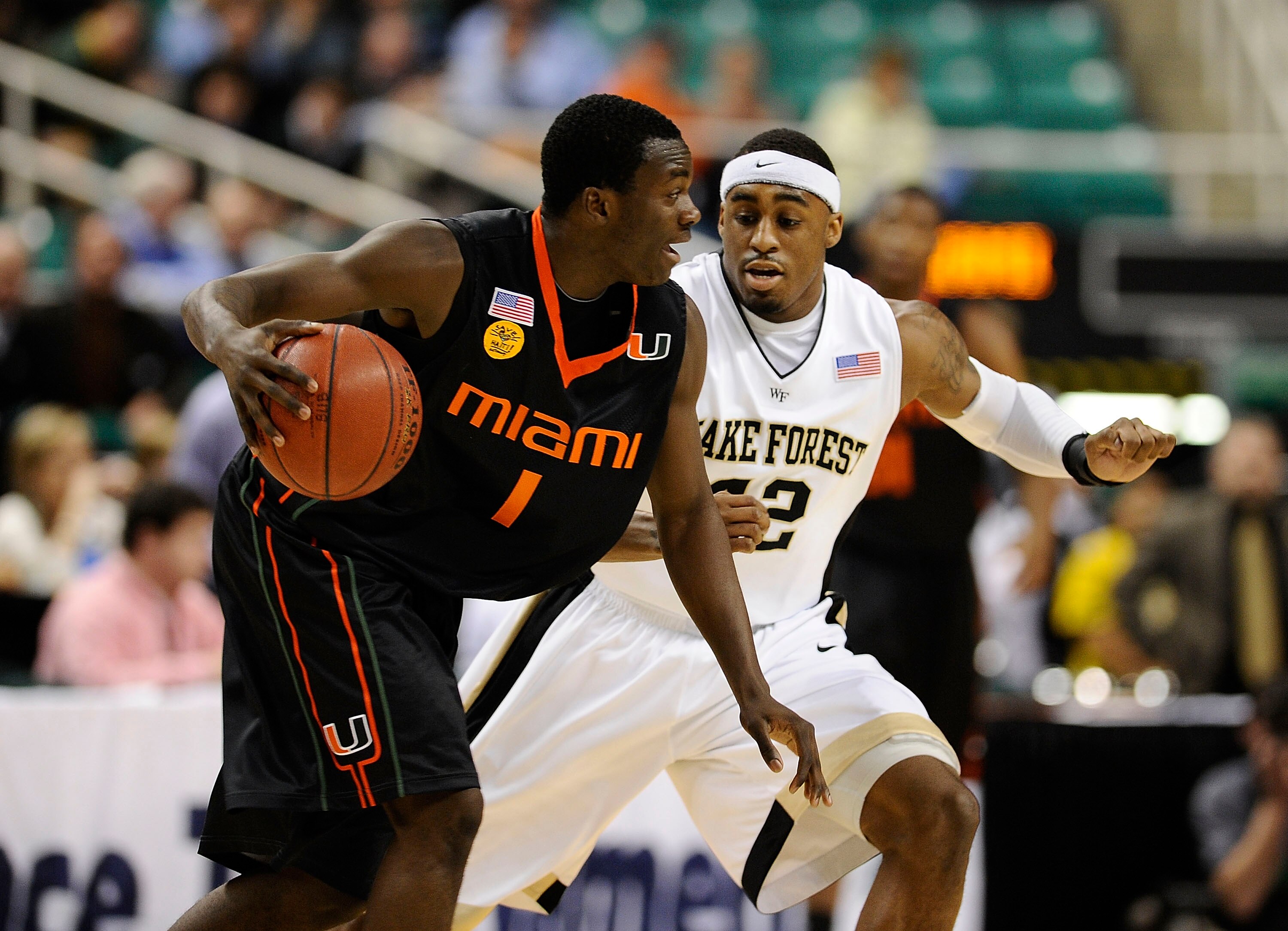 GREENSBORO, NC - MARCH 11:  L.D. Williams #42 of the Wake Forest Demon Deacons guards Durand Scott #1 of the University of Miami Hurricanes in their first round game in the 2010 ACC Men's Basketball Tournament at the Greensboro Coliseum on March 11, 2010