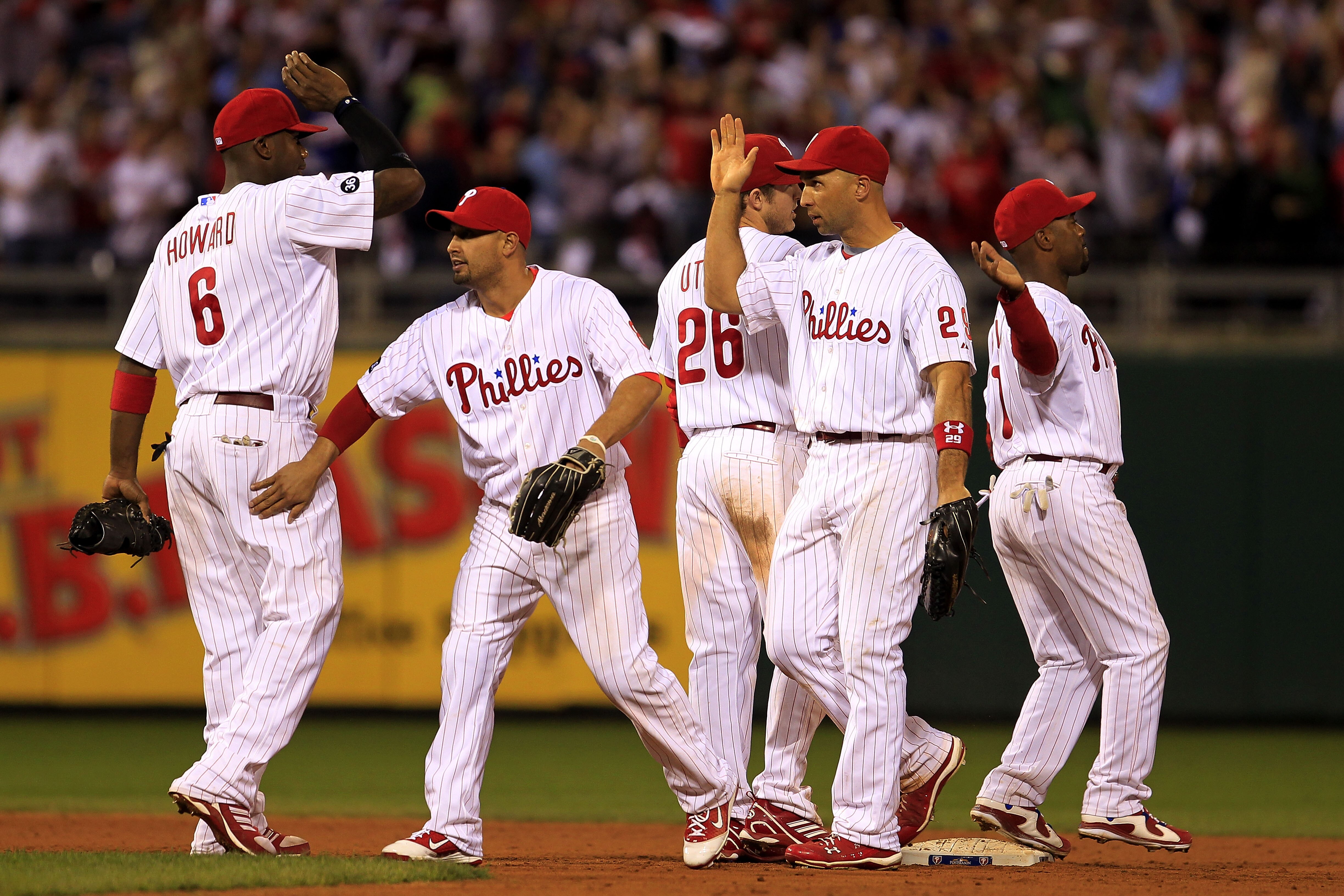 PHILADELPHIA - OCTOBER 08: The Philadelphia Phillies celebrate victory over the Cincinnati Reds in game 2 of NLDS at Citizens Bank Park on October 8, 2010 in Philadelphia, Pennsylvania. The Phillies defeated the Reds 7-4.  (Photo by Chris Trotman/Getty Im