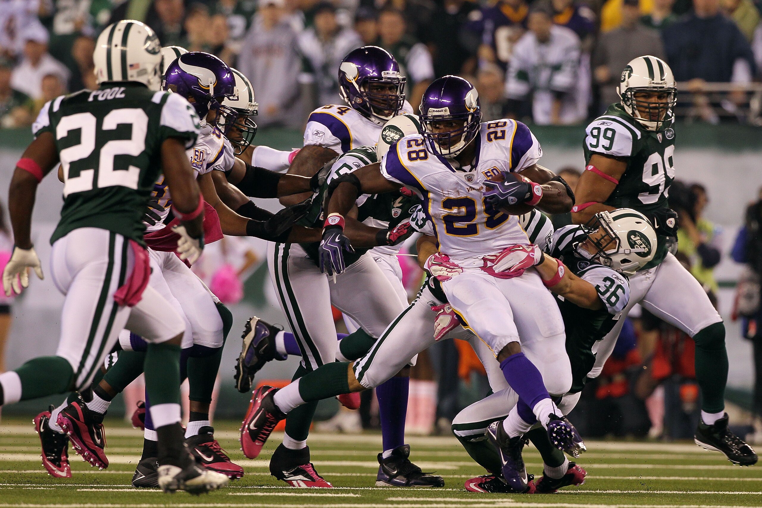 EAST RUTHERFORD, NJ - OCTOBER 11:  Adrian Peterson #28 of the Minnesota Vikings runs the ball against Jim Leonhard #36 of the New York Jets at New Meadowlands Stadium on October 11, 2010 in East Rutherford, New Jersey.  (Photo by Jim McIsaac/Getty Images)