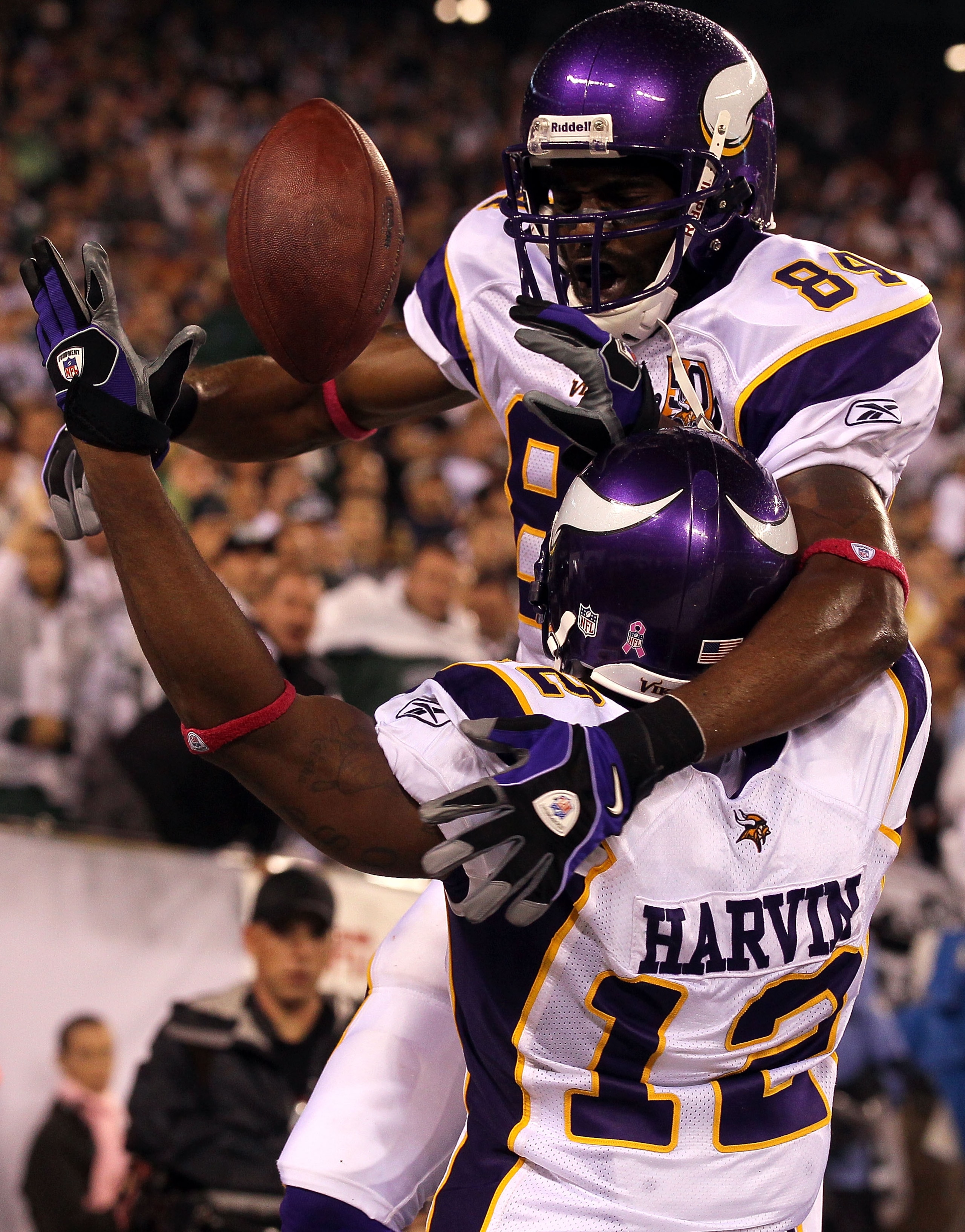 EAST RUTHERFORD, NJ - OCTOBER 11:  Randy Moss #84 and Percy Harvin #12 of the Minnesota Vikings react after Harvin caught a 34-yard touchdown pass in the fourth quarter against the New York Jets at New Meadowlands Stadium on October 11, 2010 in East Ruthe