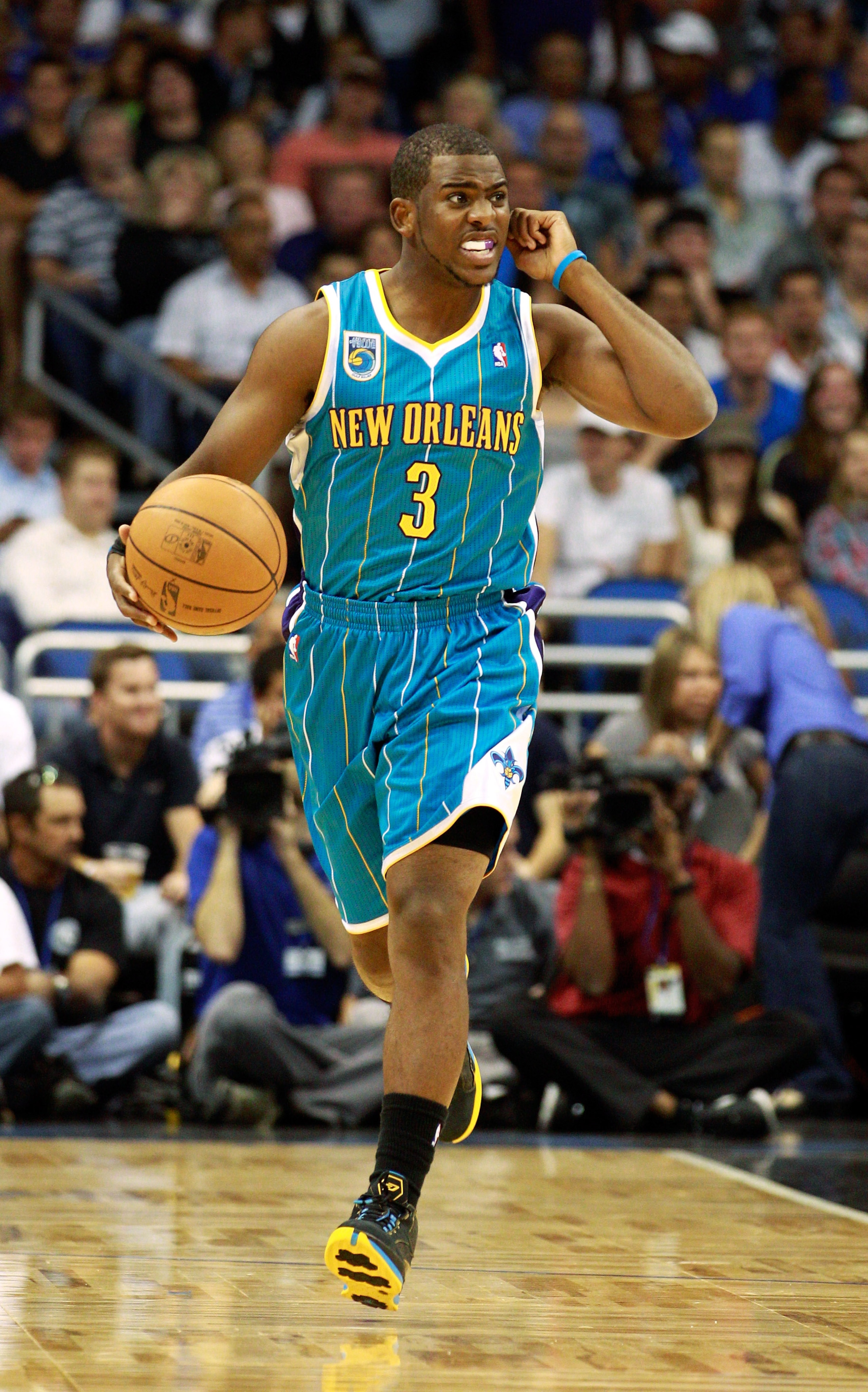 ORLANDO, FL - OCTOBER 10:  Chris Paul #3 of the New Orleans Hornets dribbles during the game against the Orlando Magic at Amway Arena on October 10, 2010 in Orlando, Florida. NOTE TO USER: User expressly acknowledges and agrees that, by downloading and or