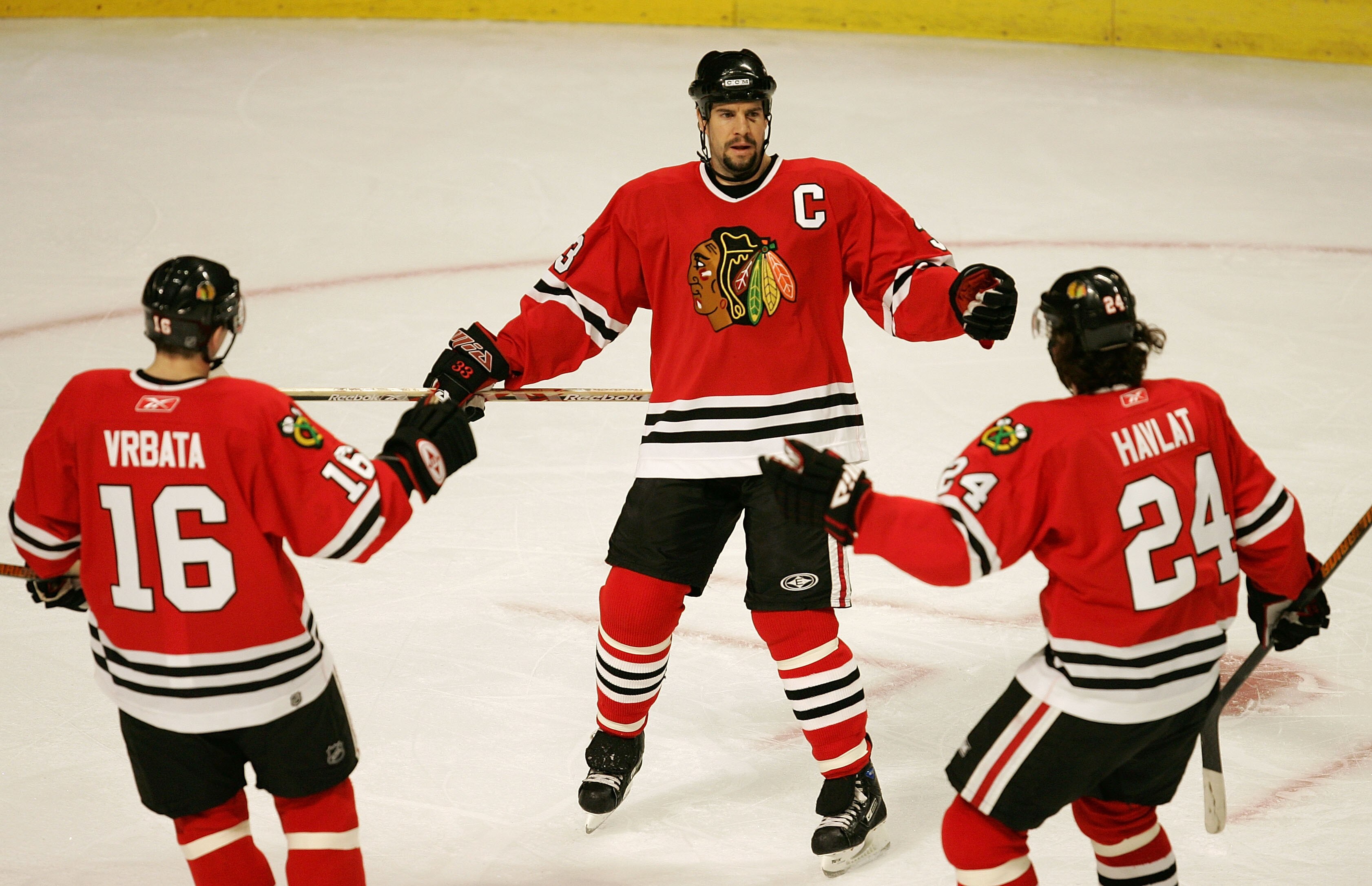 CHICAGO - FEBRUARY 25: Adrian Aucoin #33 of the Chicago Blackhawks celebrates play goal with teammates Radim Vrbata #16 and Martin Havlat #24 (both assisted on Aucoin's goal) during the first period against the St. Louis Blues February 25, 2007 at the Un CHICAGO - FEBRUARY 25: Adrian Aucoin #33 of the Chicago Blackhawks celebrates play goal with teammates Radim Vrbata #16 and Martin Havlat #24 (both assisted on Aucoin's goal) during the first period against the St. Louis Blues February 25, 2007 at the Un