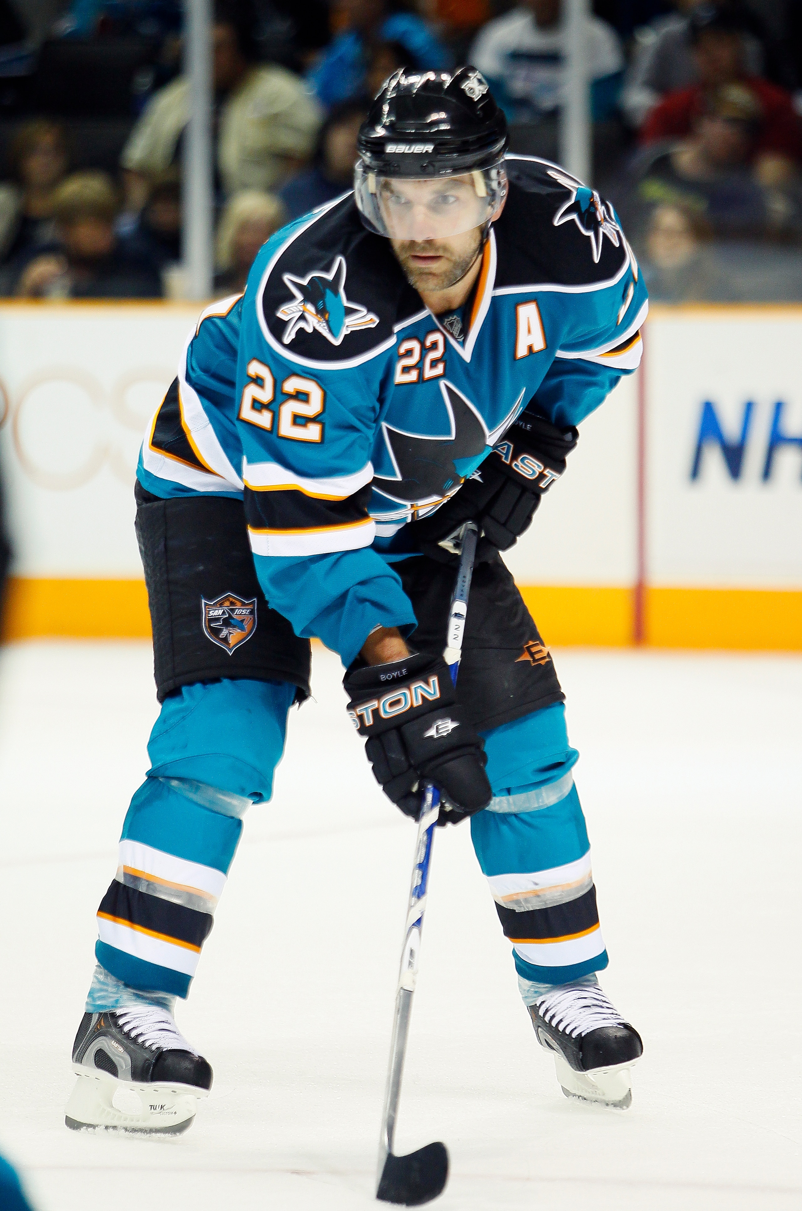 SAN JOSE, CA - SEPTEMBER 25:  Dan Boyle #22 of the San Jose Sharks waits for a face-off against the Phoenix Coyotes in a preseason split-squad game at HP Pavilion on September 25, 2010 in San Jose, California.  The Sharks won 3-1.  (Photo by Brian Bahr/Ge