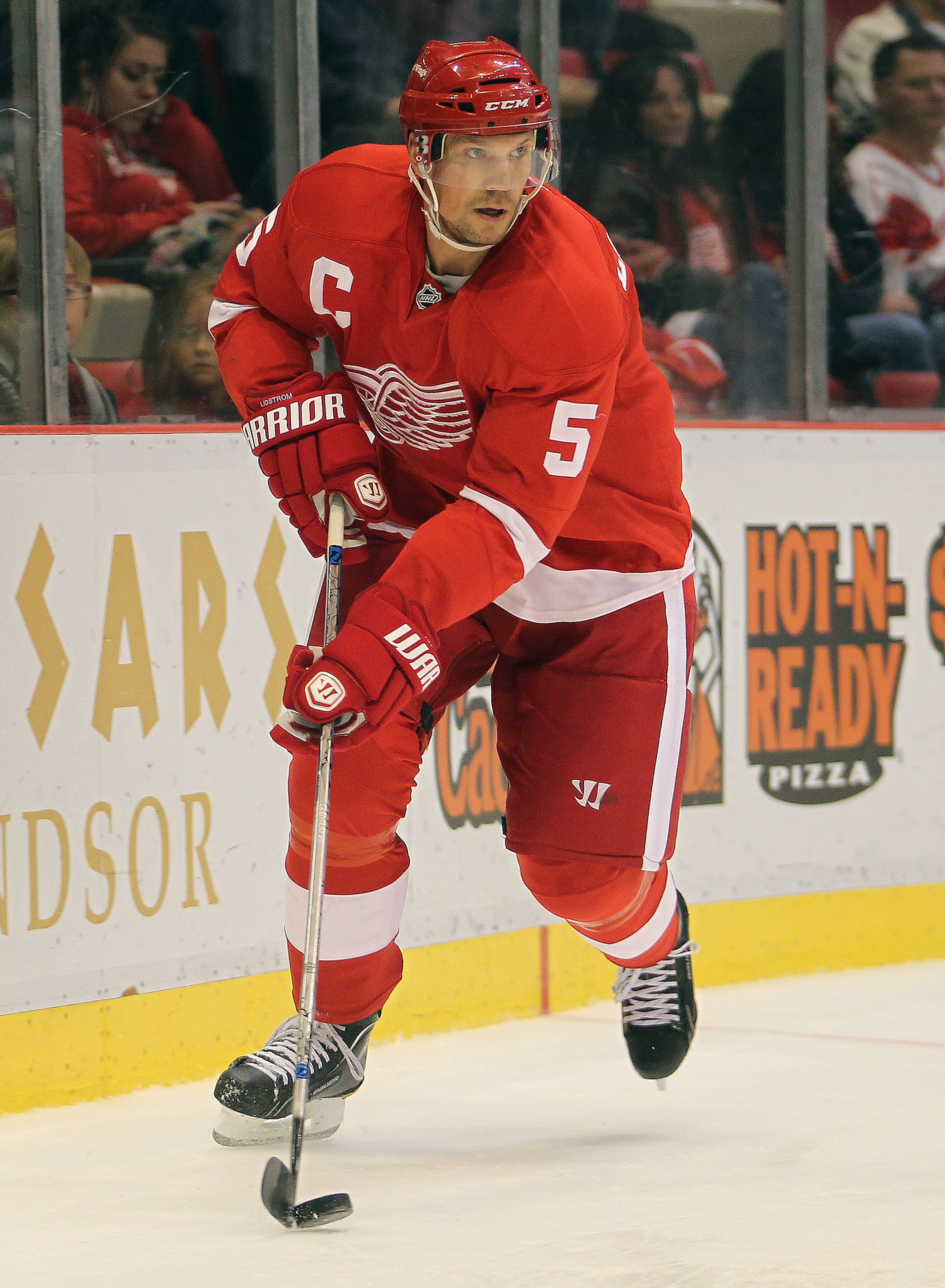 DETROIT, MI - OCTOBER 03:  Nicklas Lidstrom #5 of the Detroit Red Wings skates with the puck in a preseason game against the Pittsburgh Penguins on October 3, 2010 at the Joe Louis Arena in Detroit, Michigan. The Penguins defeated the Red Wings 5-2. (Phot