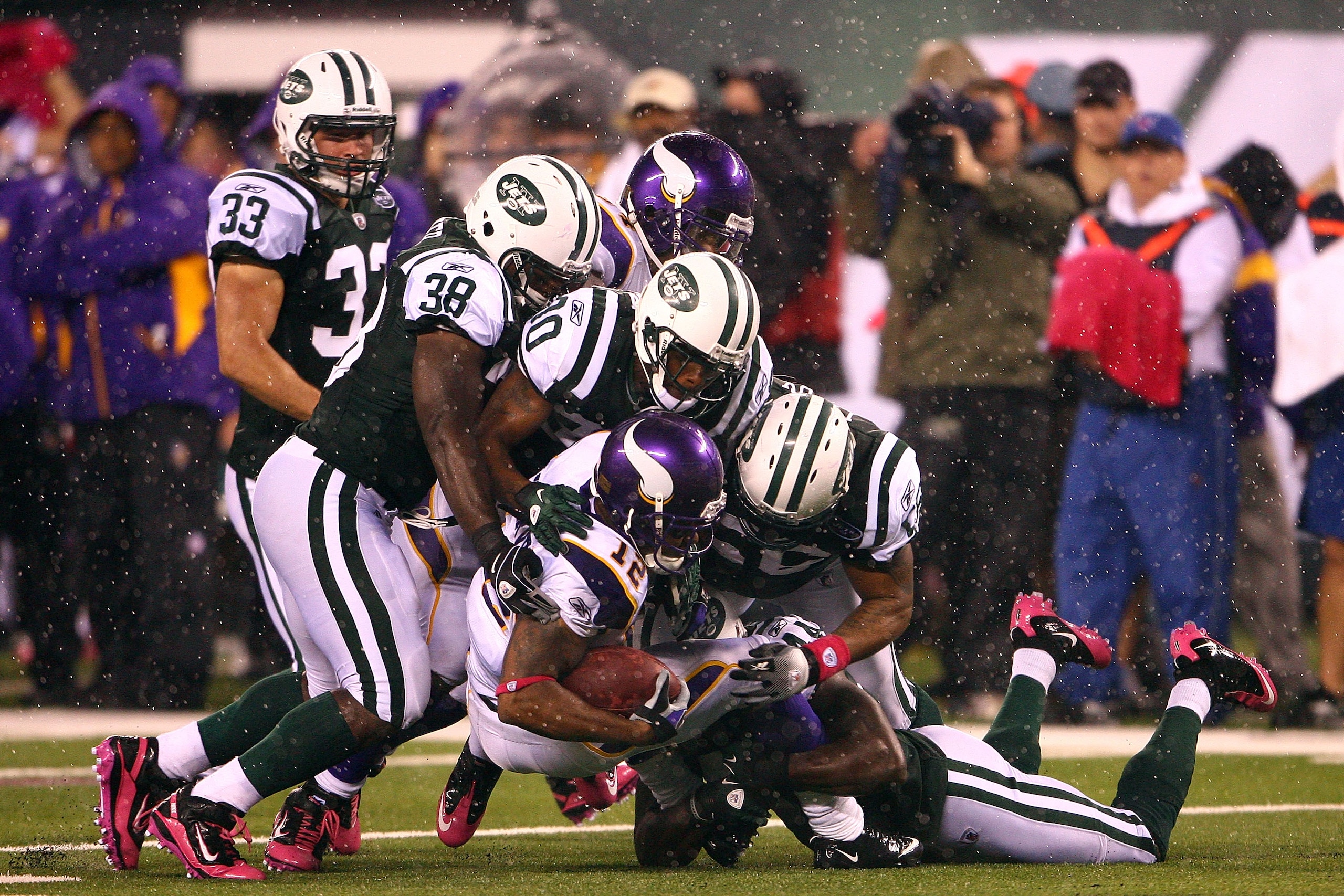 EAST RUTHERFORD, NJ - OCTOBER 11:  Percy Harvin #12 of the Minnesota Vikings is tackled on a kick return by the New York Jets at New Meadowlands Stadium on October 11, 2010 in East Rutherford, New Jersey.  (Photo by Andrew Burton/Getty Images)