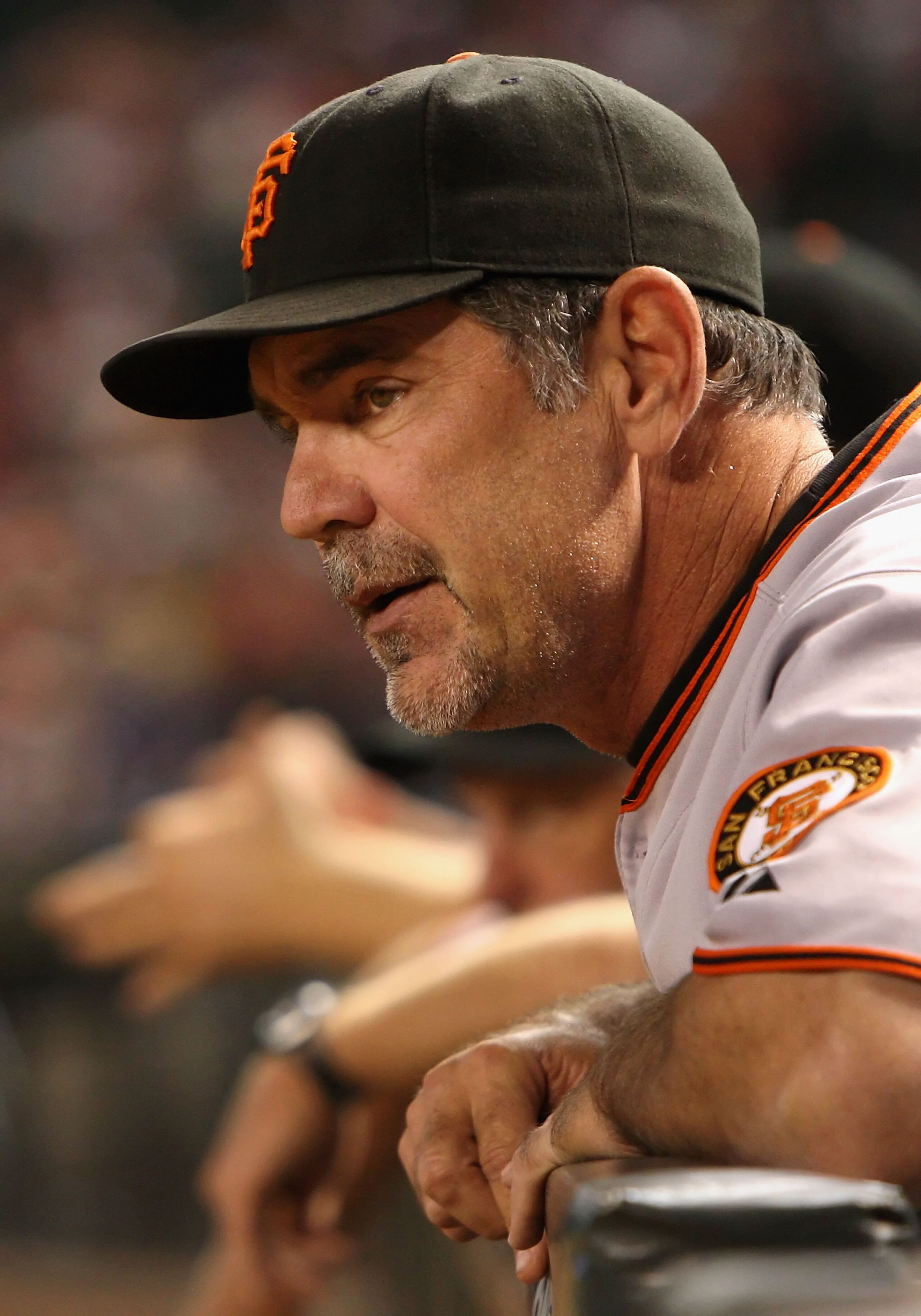 PHOENIX - SEPTEMBER 23:  Bruce Bochy #15 of the San Francisco Giants watches from the dugout during the major league baseball game against the Arizona Diamondbacks at Chase Field on September 23, 2009 in Phoenix, Arizona. The Giants defeated the Diamondba