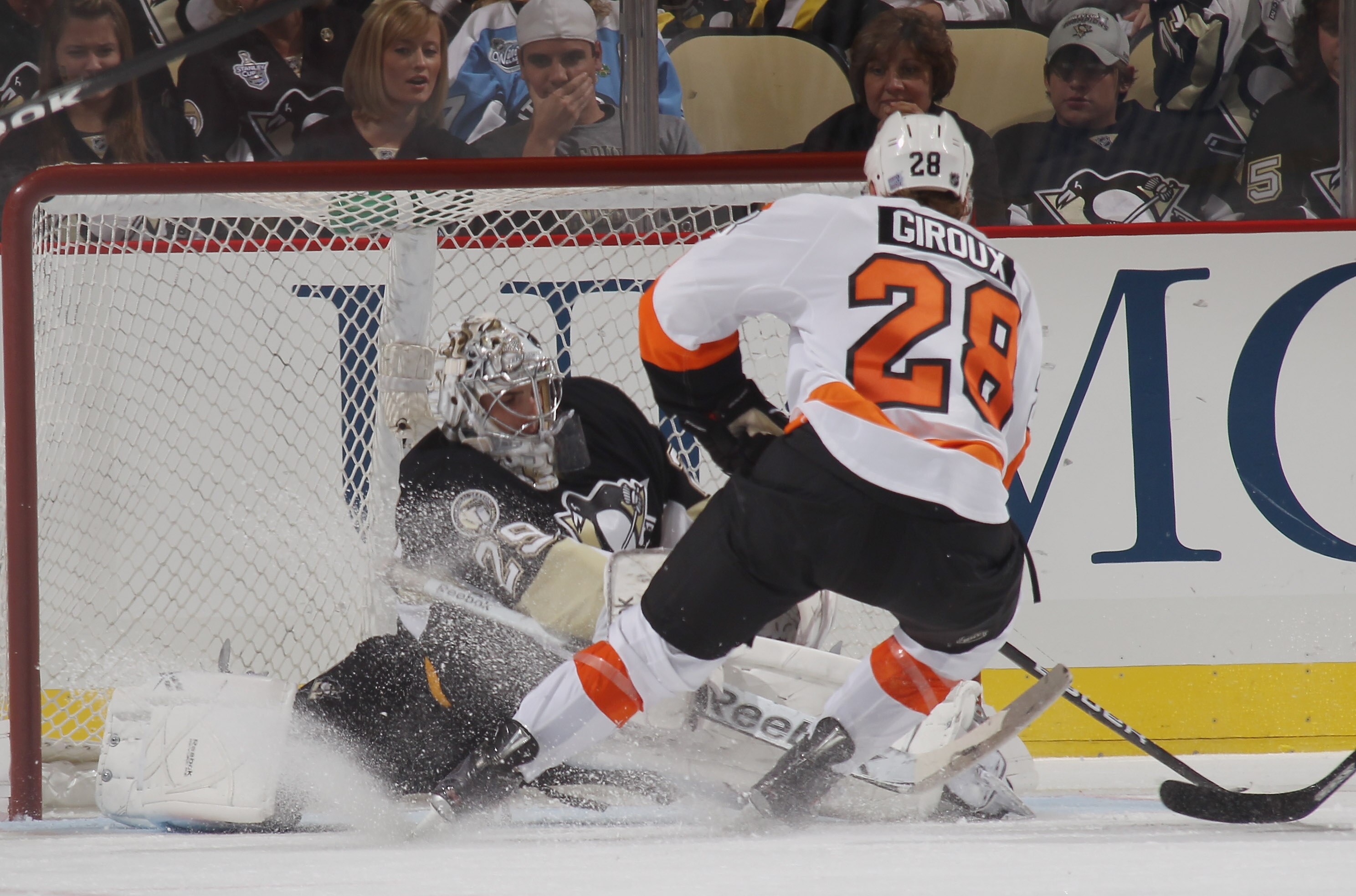 PITTSBURGH - OCTOBER 07: Claude Giroux #28 of the Philadelphia Flyers scores the short-handed game-winning goal at 4:55 of the third period against Marc-Andre Fleury #29 of the Pittsburgh Penguins at the Consol Energy Center on October 7, 2010 in Pittsbur