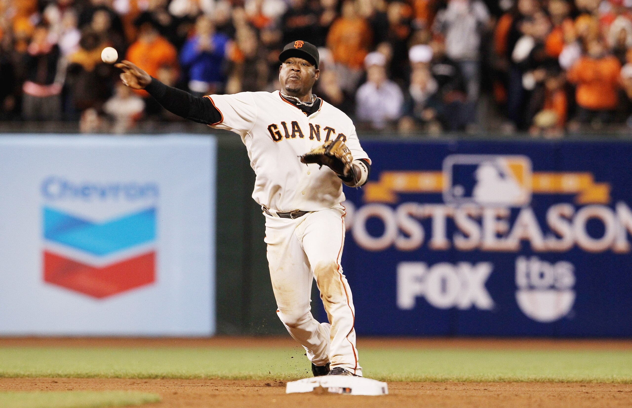 SAN FRANCISCO - OCTOBER 07:  Juan Uribe #5 of the San Francisco Giants throws to first during the ninth inning against the Atlanta Braves game one of the NLDS at AT&T Park on October 7, 2010 in San Francisco, California.  (Photo by Justin Sullivan/Getty I