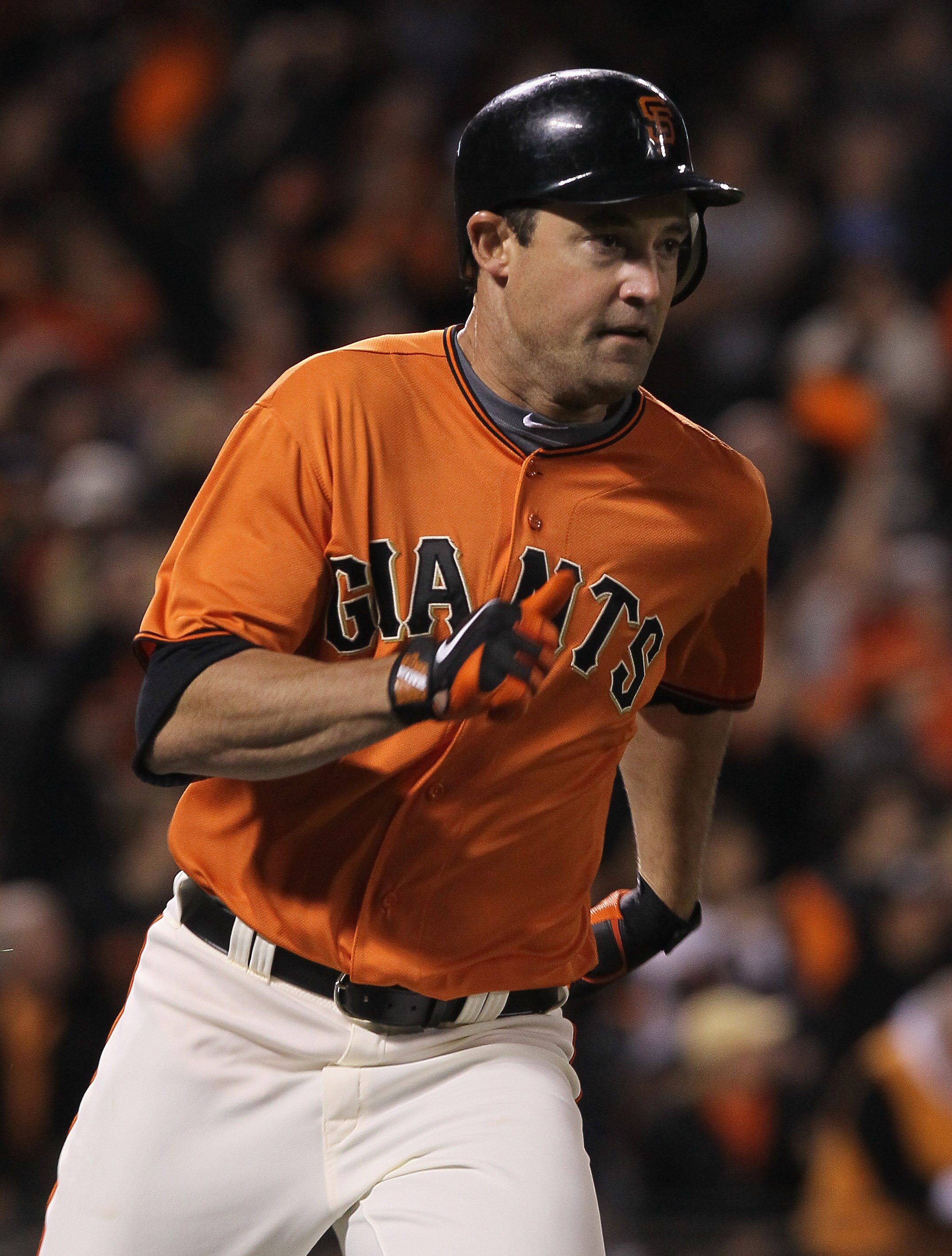 SAN FRANCISCO - OCTOBER 08:  Pat Burrell #9 of the San Francisco Giants runs to first base enroute to a double during the sixth inning of the National League Division Series with the Atlanta Braves at AT&T Park on October 8, 2010 in San Francisco, Califor