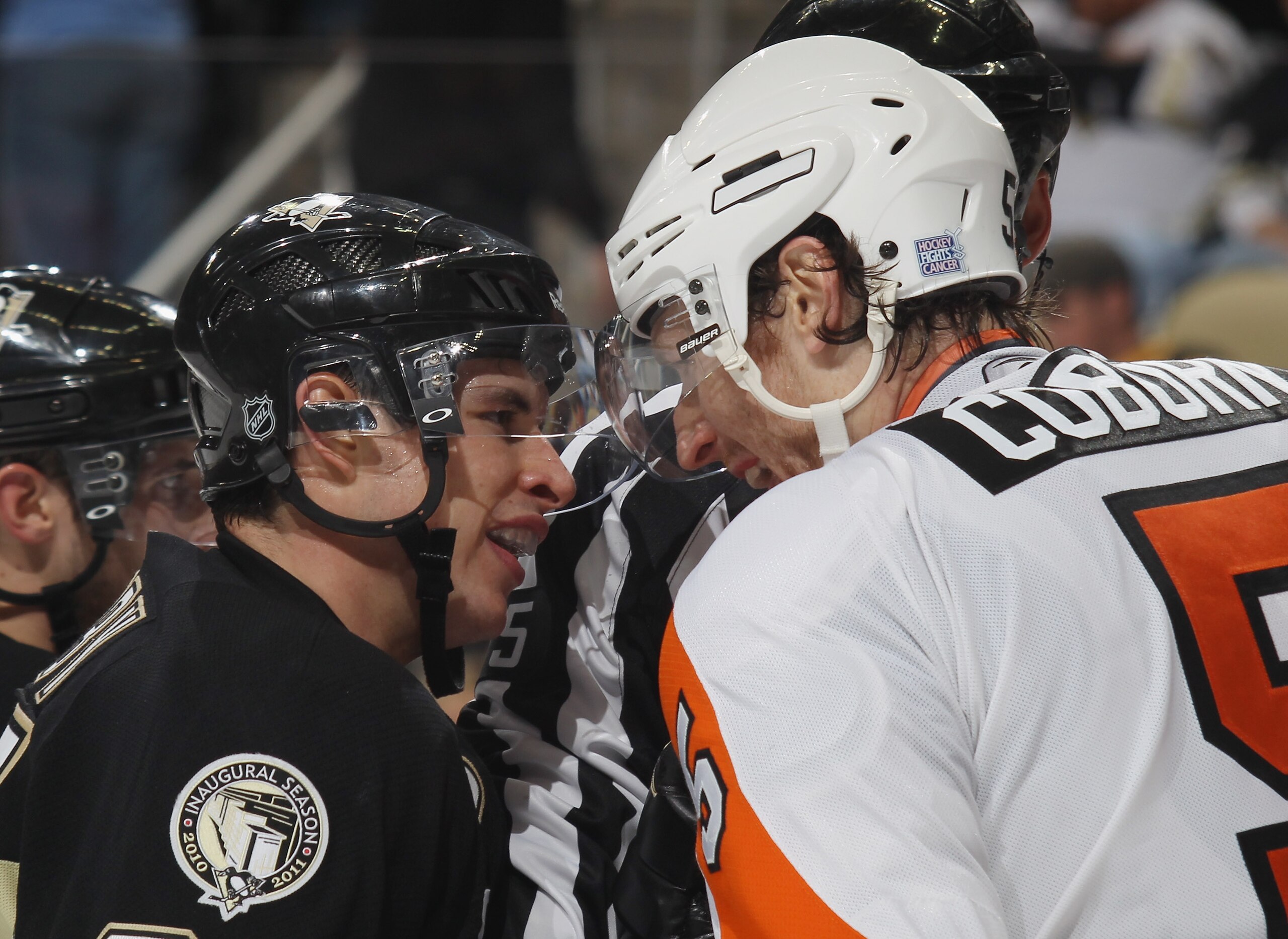 PITTSBURGH - OCTOBER 07: Sidney Crosby #87 of the Pittsburgh Penguins exchanges words with Braydon Coburn #5 of the Philadelphia Flyers at the Consol Energy Center on October 7, 2010 in Pittsburgh, Pennsylvania.  (Photo by Bruce Bennett/Getty Images)