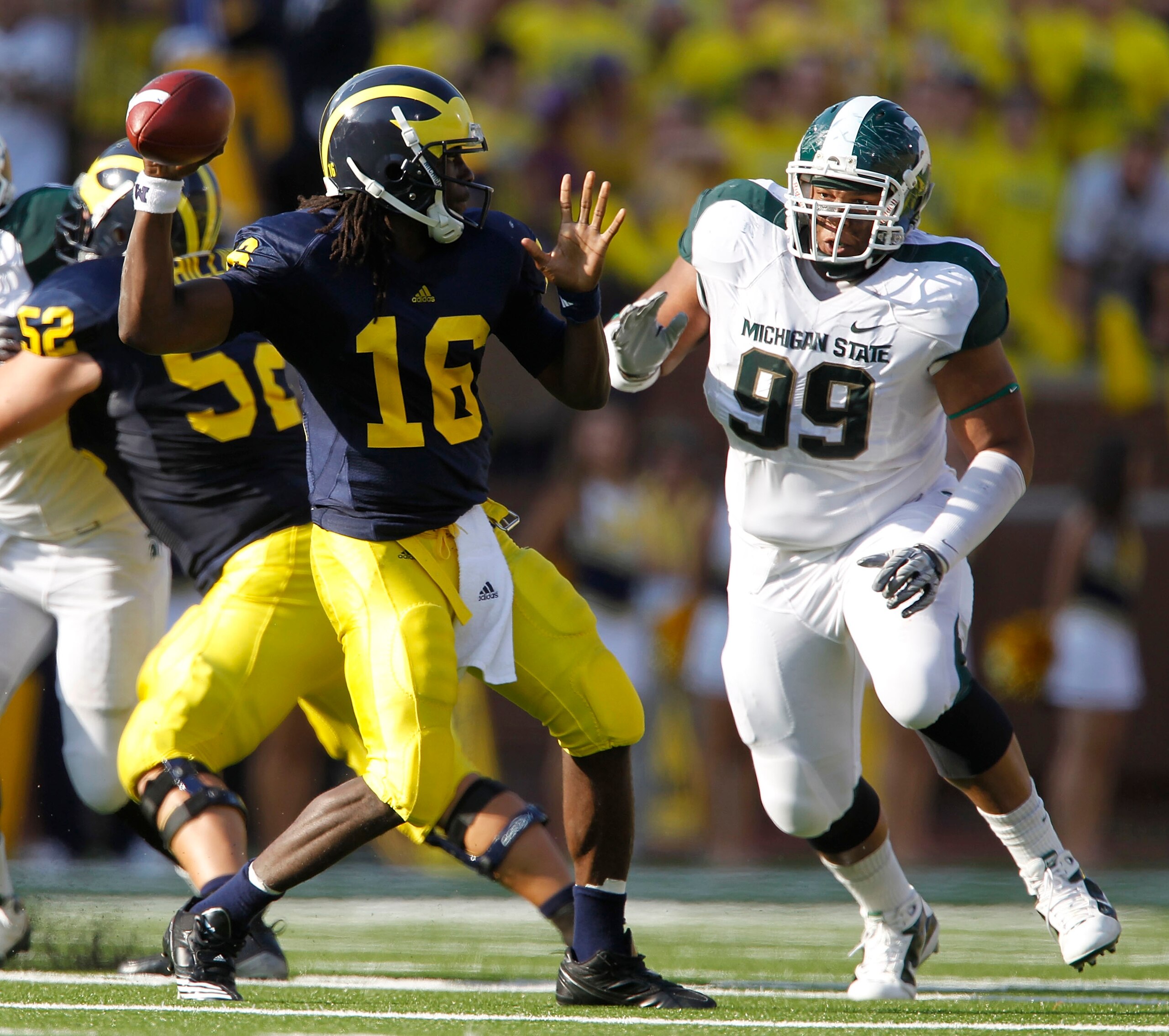 ANN ARBOR, MI - OCTOBER 09: Jerel Worthy #99 of the Michigan State Spartans rushes Denard Robinson #16 of the Michigan Wolverines during the game on October 9, 2010 at Michigan Stadium in Ann Arbor, Michigan. (Photo by Leon Halip/Getty Images)