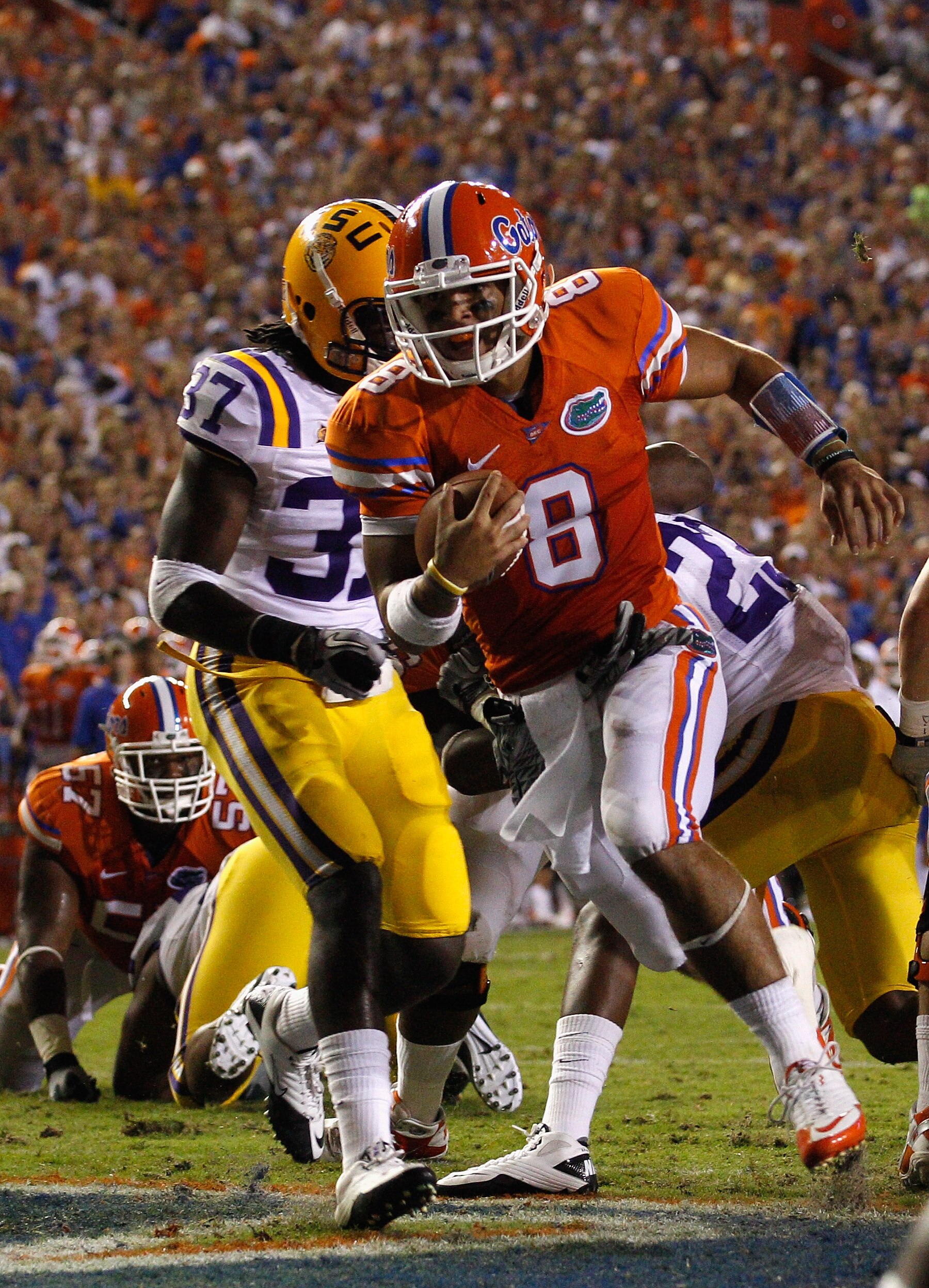 GAINESVILLE, FL - OCTOBER 09: Quarterback Trey Burton #8 of the Florida Gators scores a touchdown during the game against the Louisiana State University Tigers at Ben Hill Griffin Stadium on October 9, 2010 in Gainesville, Florida. (Photo by Sam Greenwo GAINESVILLE, FL - OCTOBER 09: Quarterback Trey Burton #8 of the Florida Gators scores a touchdown during the game against the Louisiana State University Tigers at Ben Hill Griffin Stadium on October 9, 2010 in Gainesville, Florida. (Photo by Sam Greenwo