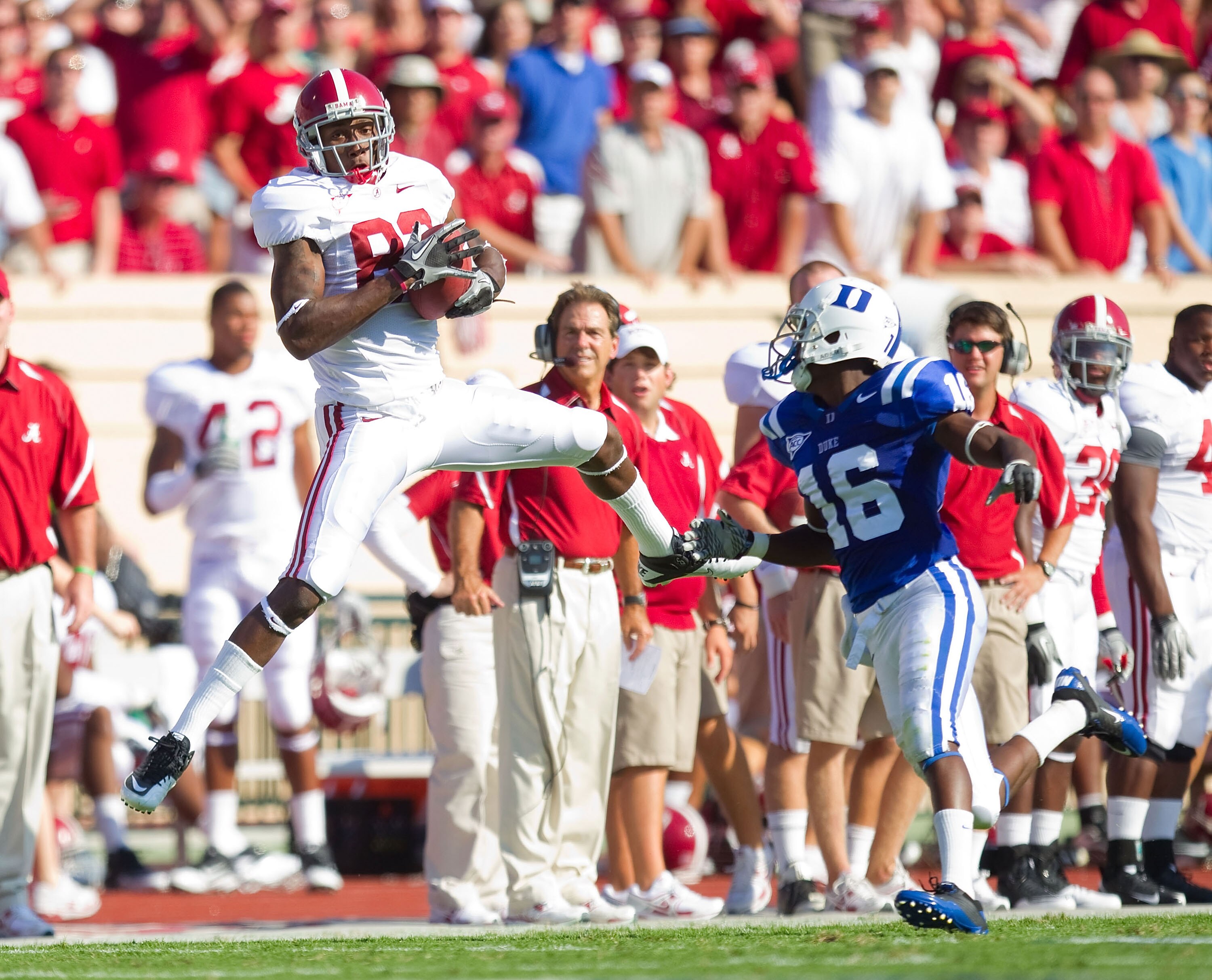 DURHAM, NC - SEPTEMBER 18: Earl Alexander #82 of the Alabama Crimson Tide makes a catch in front of Chris Rwabukamba #16 of the Duke Blue Devils at Wallace Wade Stadium on September 18, 2010 in Durham, North Carolina.  The Crimson Tide defeated the Blue D