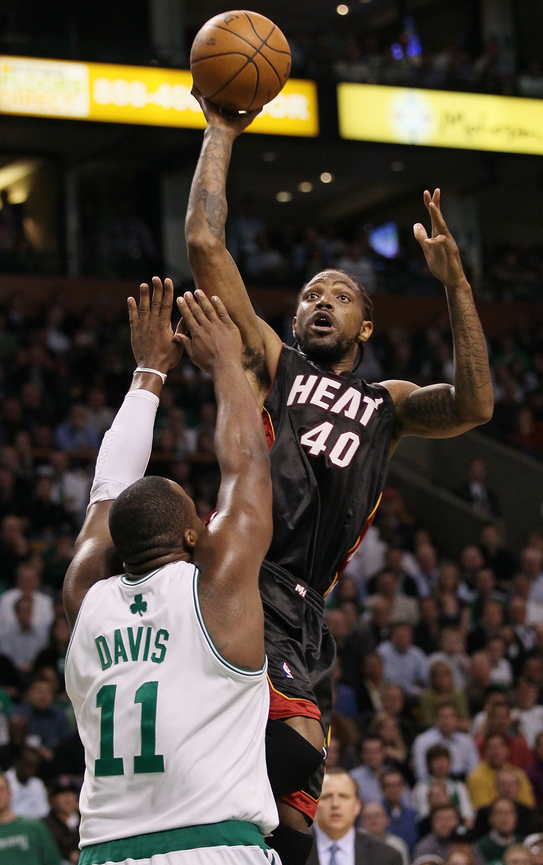 BOSTON - APRIL 27:  Udonis Haslem #40 of the Miami Heat takes a shot as Glen Davis #11 of the Boston Celtics defends during Game Five of the Eastern Conference Quarterfinals of the 2010 NBA playoffs at the TD Garden on April 27, 2010 in Boston, Massachuse