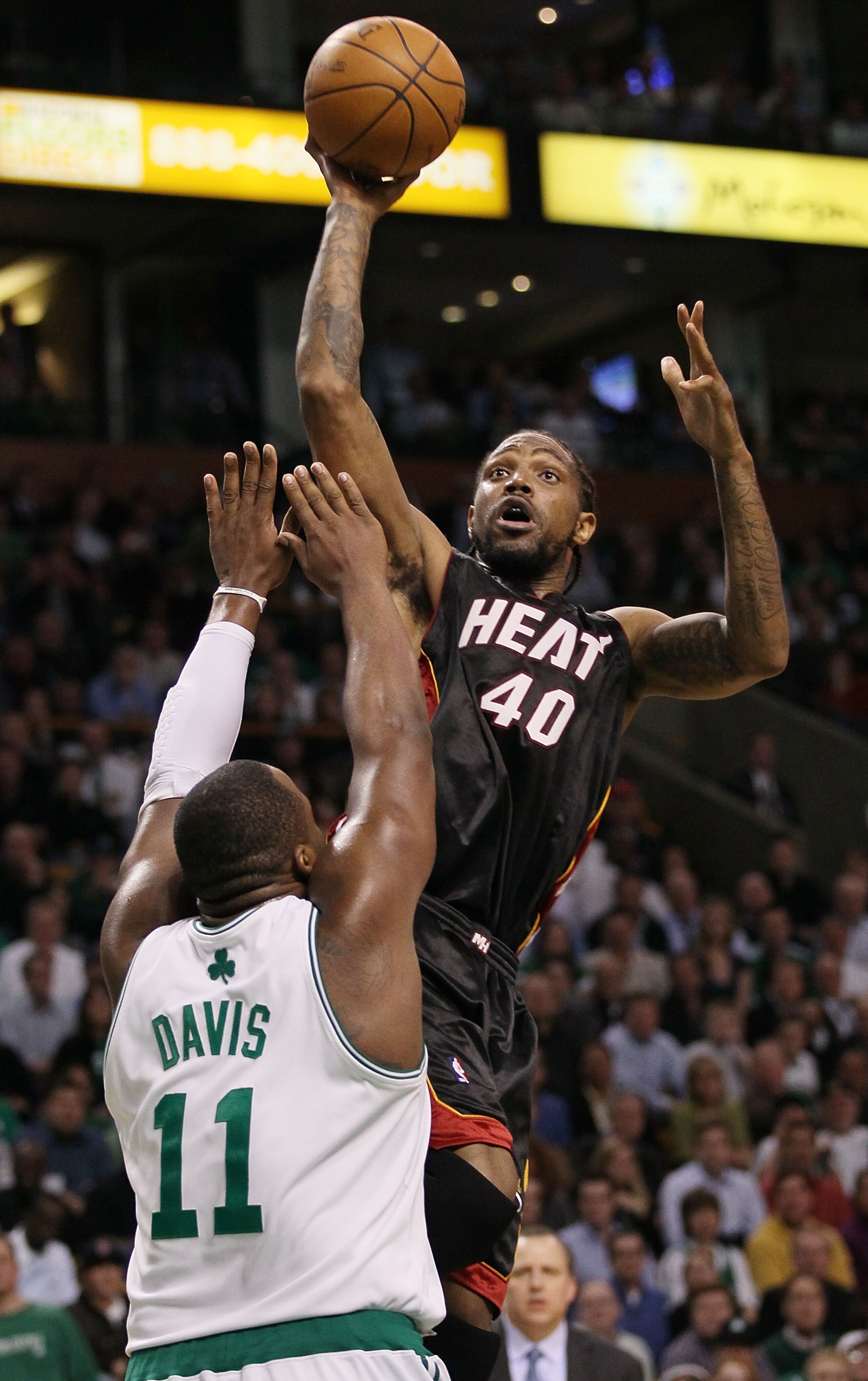 BOSTON - APRIL 27: Udonis Haslem #40 of the Miami Heat takes a shot as Glen Davis #11 of the Boston Celtics defends during Game Five of the Eastern Conference Quarterfinals of the 2010 NBA playoffs at the TD Garden on April 27, 2010 in Boston, Massachuse BOSTON - APRIL 27: Udonis Haslem #40 of the Miami Heat takes a shot as Glen Davis #11 of the Boston Celtics defends during Game Five of the Eastern Conference Quarterfinals of the 2010 NBA playoffs at the TD Garden on April 27, 2010 in Boston, Massachuse