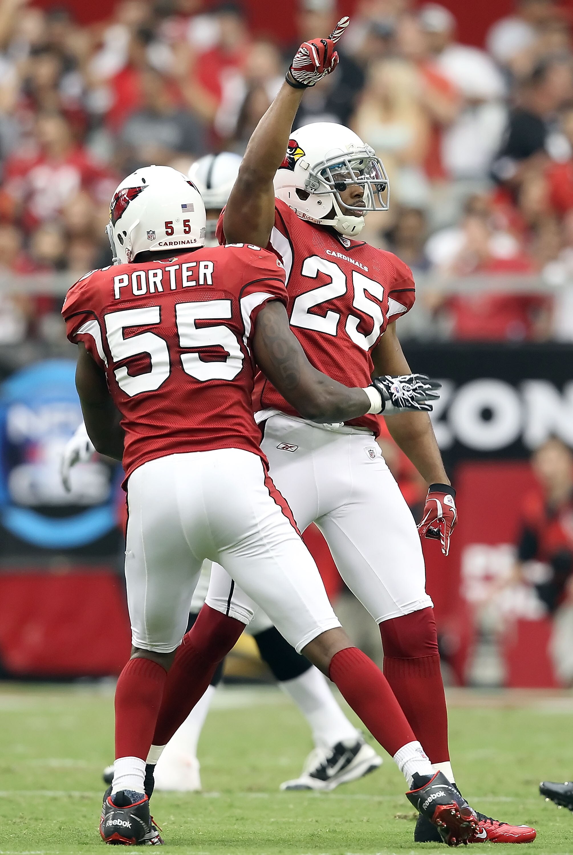 GLENDALE, AZ - SEPTEMBER 26:  Safety Kerry Rhodes #25 of the Arizona Cardinals celebrates after making a defensive stop against the Oakland Raiders during the second quarter of the NFL game at the University of Phoenix Stadium on September 26, 2010 in Gle