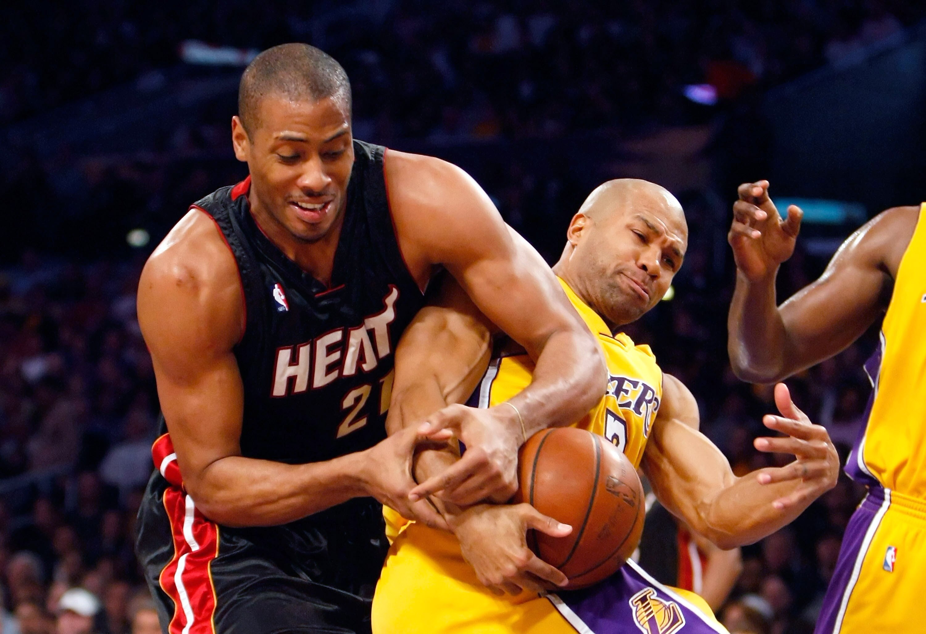LOS ANGELES, CA - DECEMBER 04:  Jamaal Magloire #21 of the Miami Heat and Derek Fisher #2 of the Los Angeles Lakers fight for a rebound in the first half at Staples Center on December 4, 2009 in Los Angeles, California. NOTE TO USER: User expressly acknow