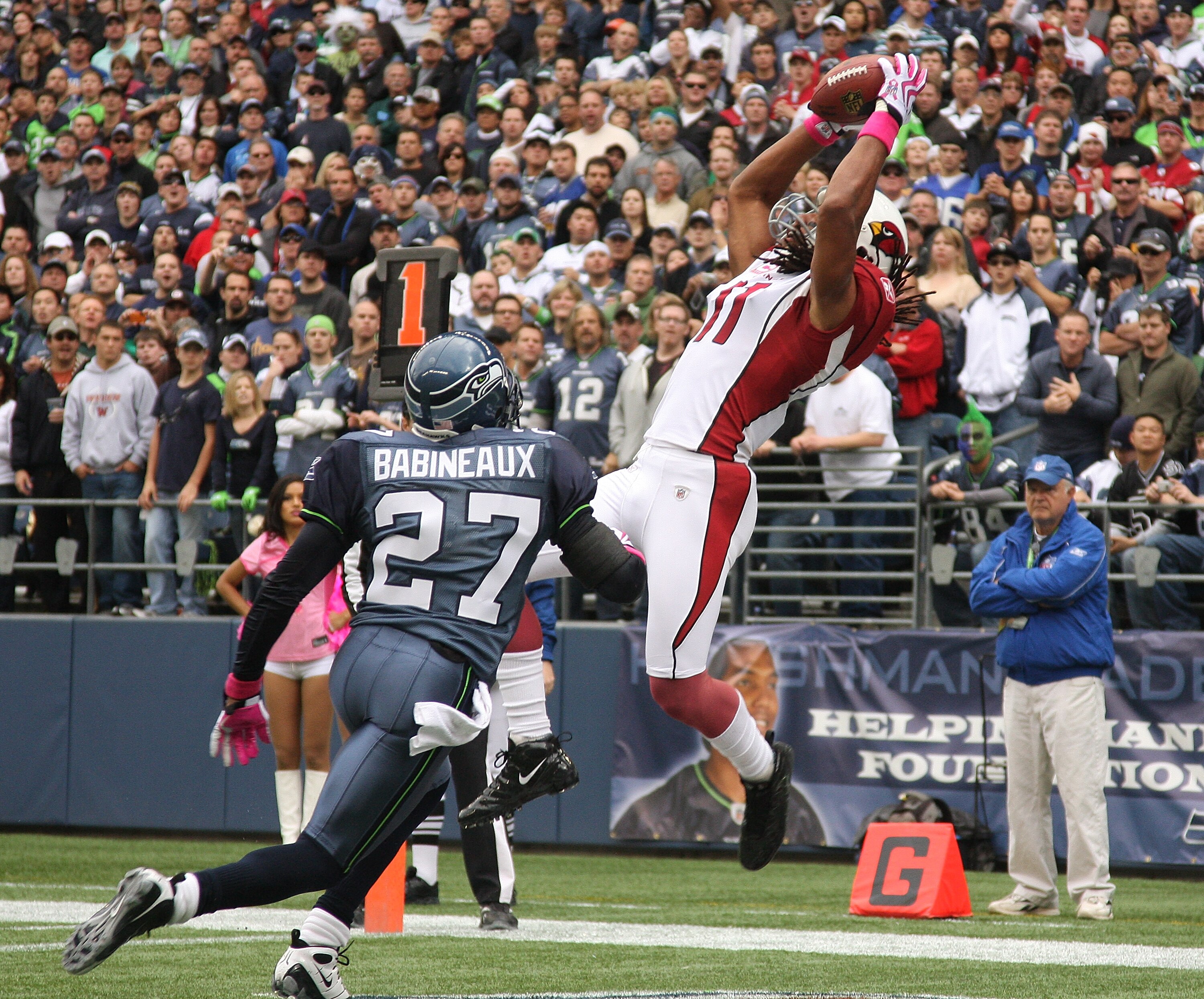 SEATTLE - OCTOBER 18: Wide receiver Larry Fitzgerald #11 of the Arizona Cardinals makes a touchdown catch against Jordan Babineaux #27 of the Seattle Seahawks on October 18, 2009 at Qwest Field in Seattle, Washington. (Photo by Otto Greule Jr/Getty Images