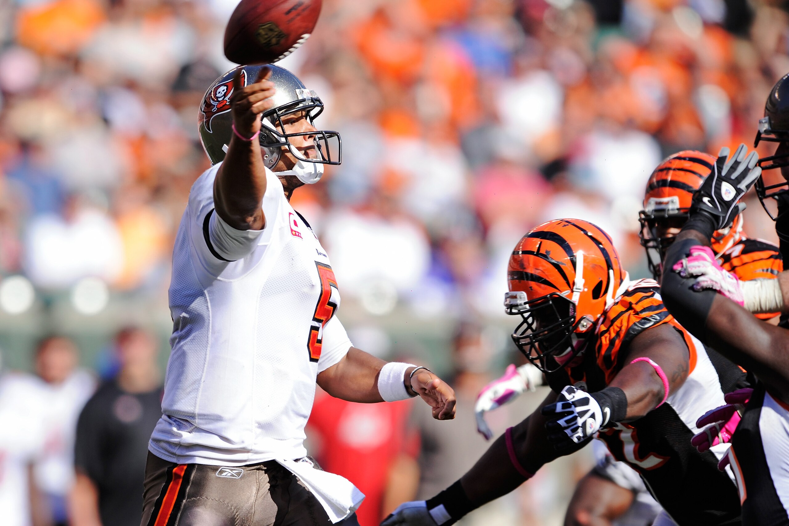 CINCINNATI, OH - OCTOBER 10:  Quarterback Josh Freeman #5 of the Tampa Bay Buccaneers gets off a pass as he is pressured by the Cincinnati Bengals defense at Paul Brown Stadium on October 10, 2010 in Cincinnati, Ohio.  (Photo by Jamie Sabau/Getty Images)