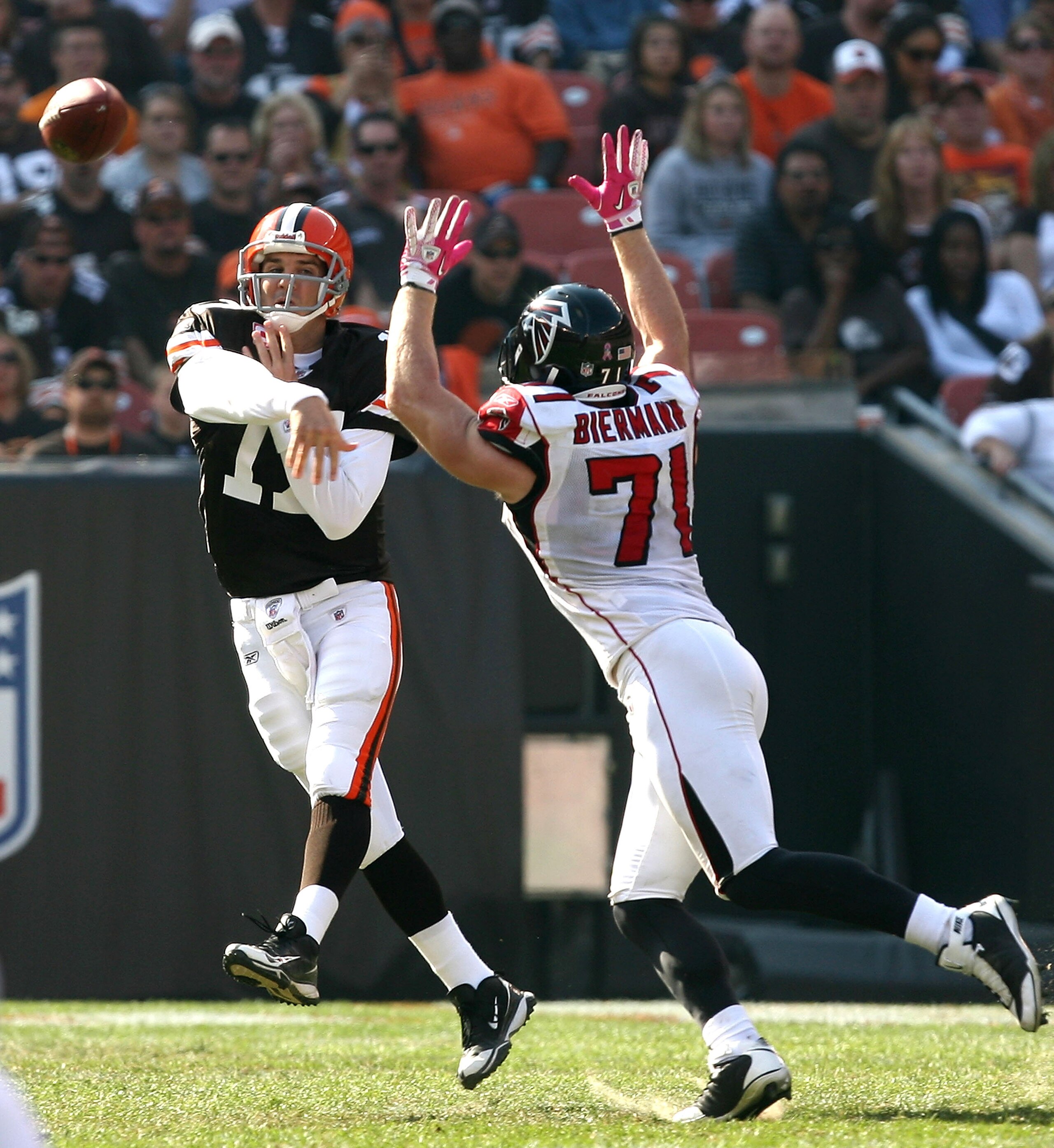 CLEVELAND - OCTOBER 10:  Quarterback Jake Delhomme #17 of the Cleveland Browns throws to a receiver as he is pressured by outside tackle Kroy Biermann #71 of the Atlanta Falcons at Cleveland Browns Stadium on October 10, 2010 in Cleveland, Ohio.  (Photo b