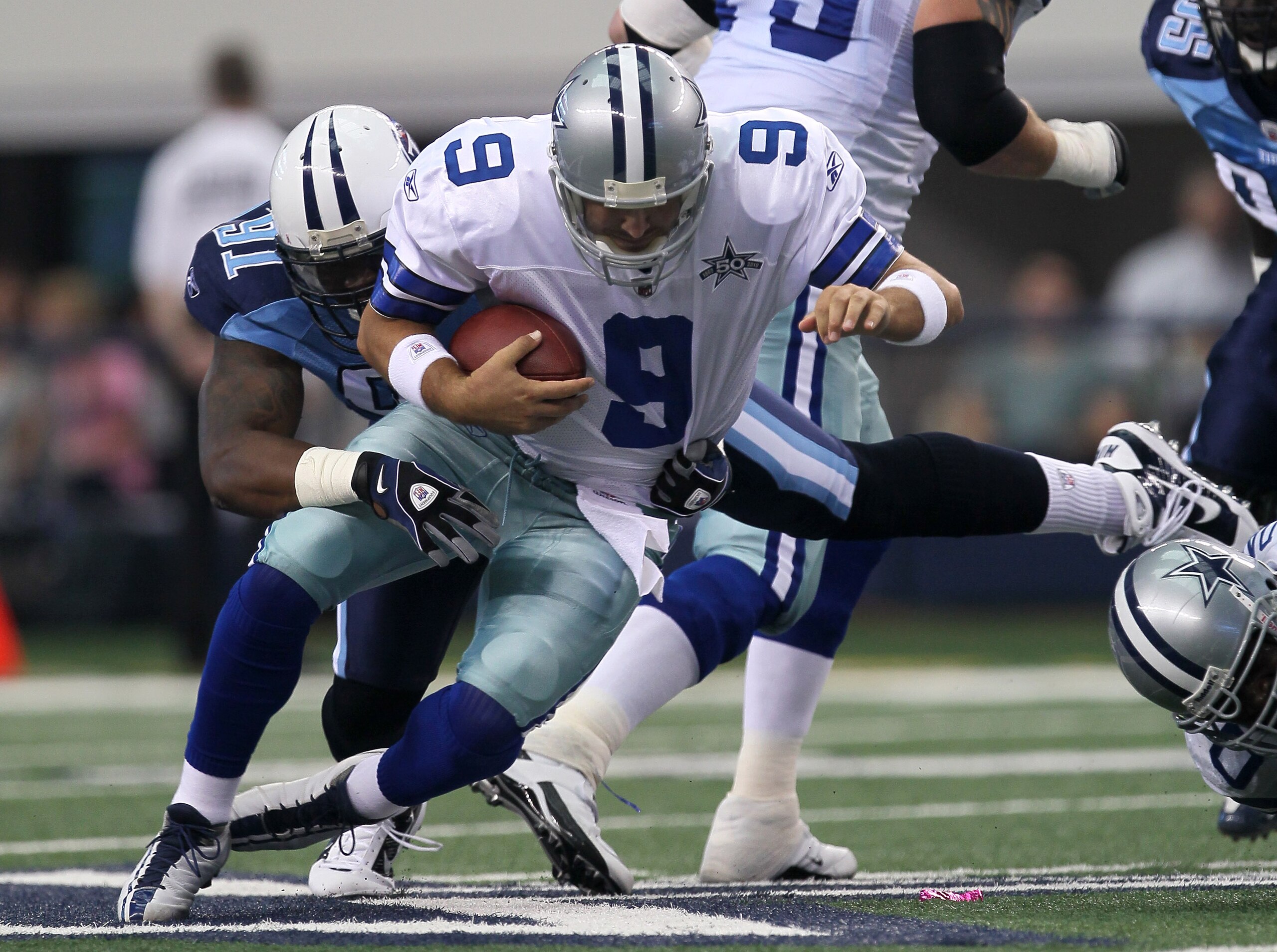 ARLINGTON, TX - OCTOBER 10: Defensive tackle Jason Jones #91 of the Tennessee Titans sacks quarterback Tony Romo #9 of the Dallas Cowboys at Cowboys Stadium on October 10, 2010 in Arlington, Texas. (Photo by Stephen Dunn/Getty Images) ARLINGTON, TX - OCTOBER 10: Defensive tackle Jason Jones #91 of the Tennessee Titans sacks quarterback Tony Romo #9 of the Dallas Cowboys at Cowboys Stadium on October 10, 2010 in Arlington, Texas. (Photo by Stephen Dunn/Getty Images)
