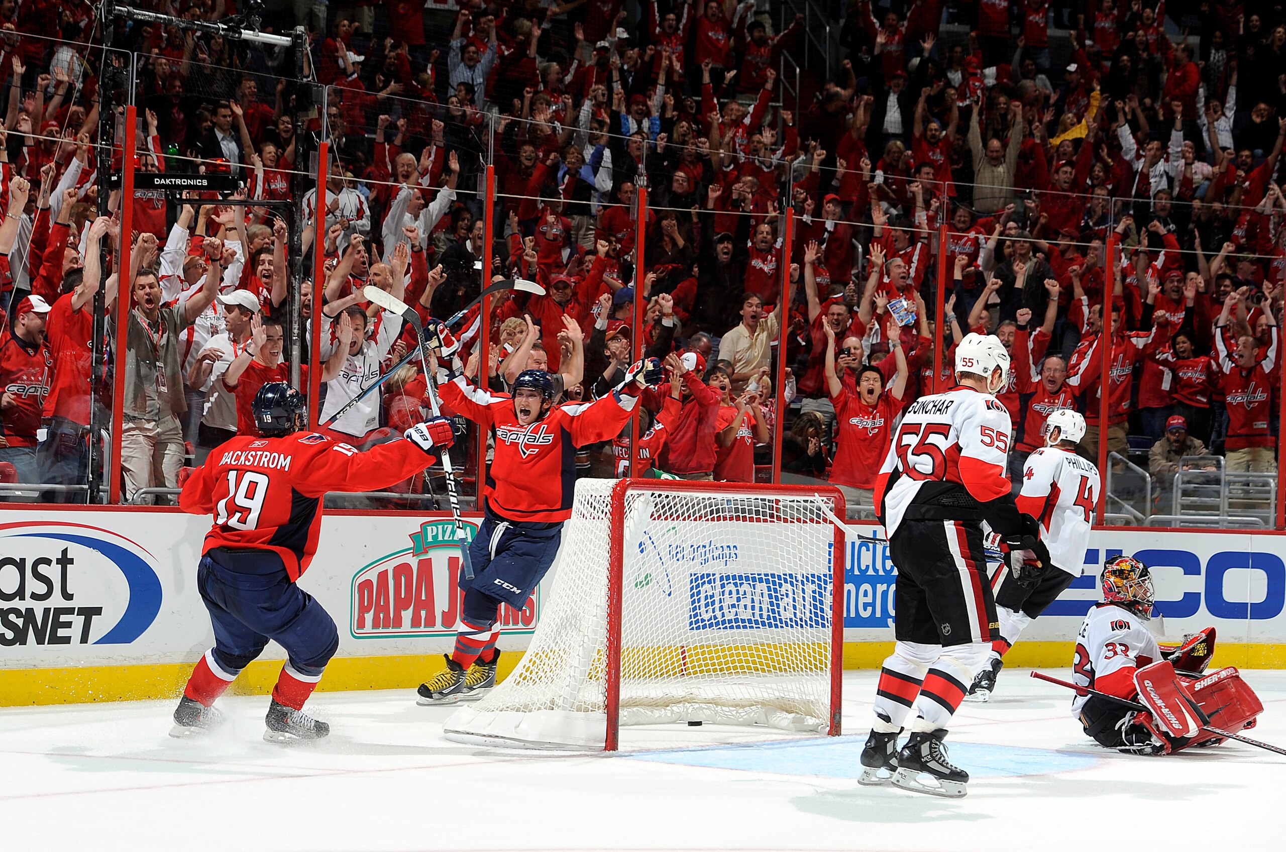 WASHINGTON - OCTOBER 11: Alex Ovechkin #8 of the Washington Capitals celebrates with Nicklas Backstrom #19 after scoring the winning goal in overtime against Pascal Leclaire #33 of the Ottawa Senators at the Verizon Center on October 11, 2010 in Washingt WASHINGTON - OCTOBER 11: Alex Ovechkin #8 of the Washington Capitals celebrates with Nicklas Backstrom #19 after scoring the winning goal in overtime against Pascal Leclaire #33 of the Ottawa Senators at the Verizon Center on October 11, 2010 in Washingt