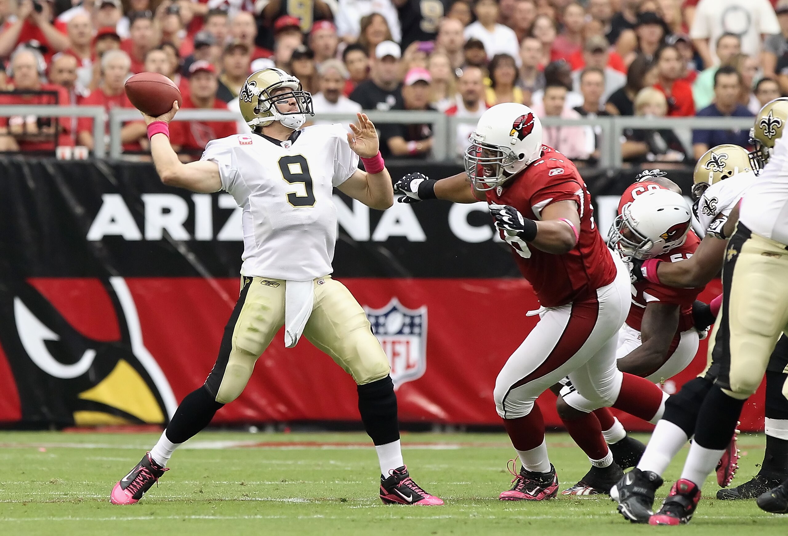 GLENDALE, AZ - OCTOBER 10: Quarterback Drew Brees #9 of the New Orleans Saints throws a pass during the NFL game against the Arizona Cardinals at the University of Phoenix Stadium on October 10, 2010 in Glendale, Arizona. The Cardinals defeated the Saint GLENDALE, AZ - OCTOBER 10: Quarterback Drew Brees #9 of the New Orleans Saints throws a pass during the NFL game against the Arizona Cardinals at the University of Phoenix Stadium on October 10, 2010 in Glendale, Arizona. The Cardinals defeated the Saint