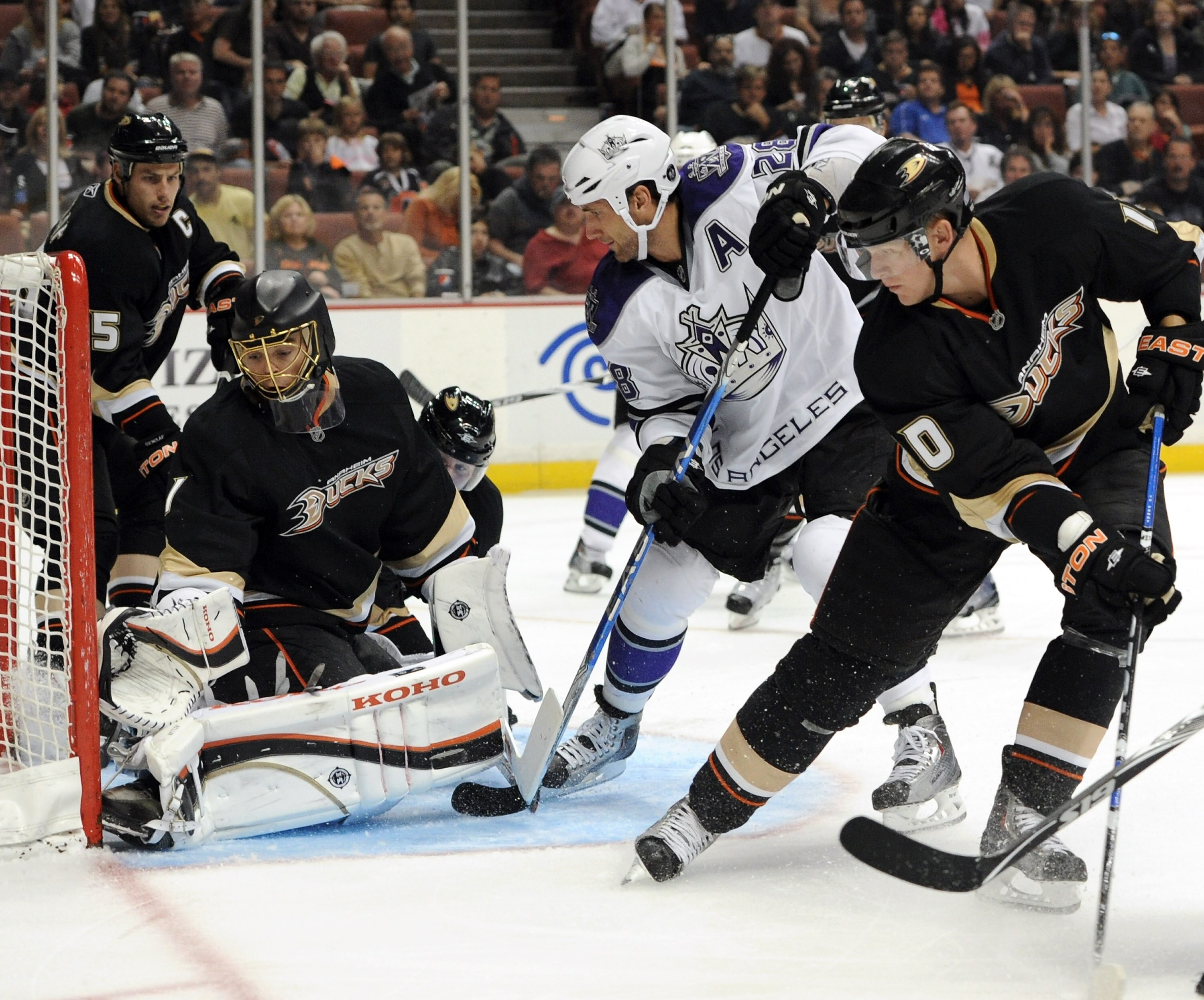 ANAHEIM, CA - OCTOBER 03: Jonas Hiller #1 of the Anaheim Ducks makes a save on Jarret Stoll #28 of the Los Angeles Kings as Corey Perry #10 and Ryan Getzlaf #15 look for a rebound at Honda Center on October 3, 2010 in Anaheim, California. (Photo by Harr ANAHEIM, CA - OCTOBER 03: Jonas Hiller #1 of the Anaheim Ducks makes a save on Jarret Stoll #28 of the Los Angeles Kings as Corey Perry #10 and Ryan Getzlaf #15 look for a rebound at Honda Center on October 3, 2010 in Anaheim, California. (Photo by Harr