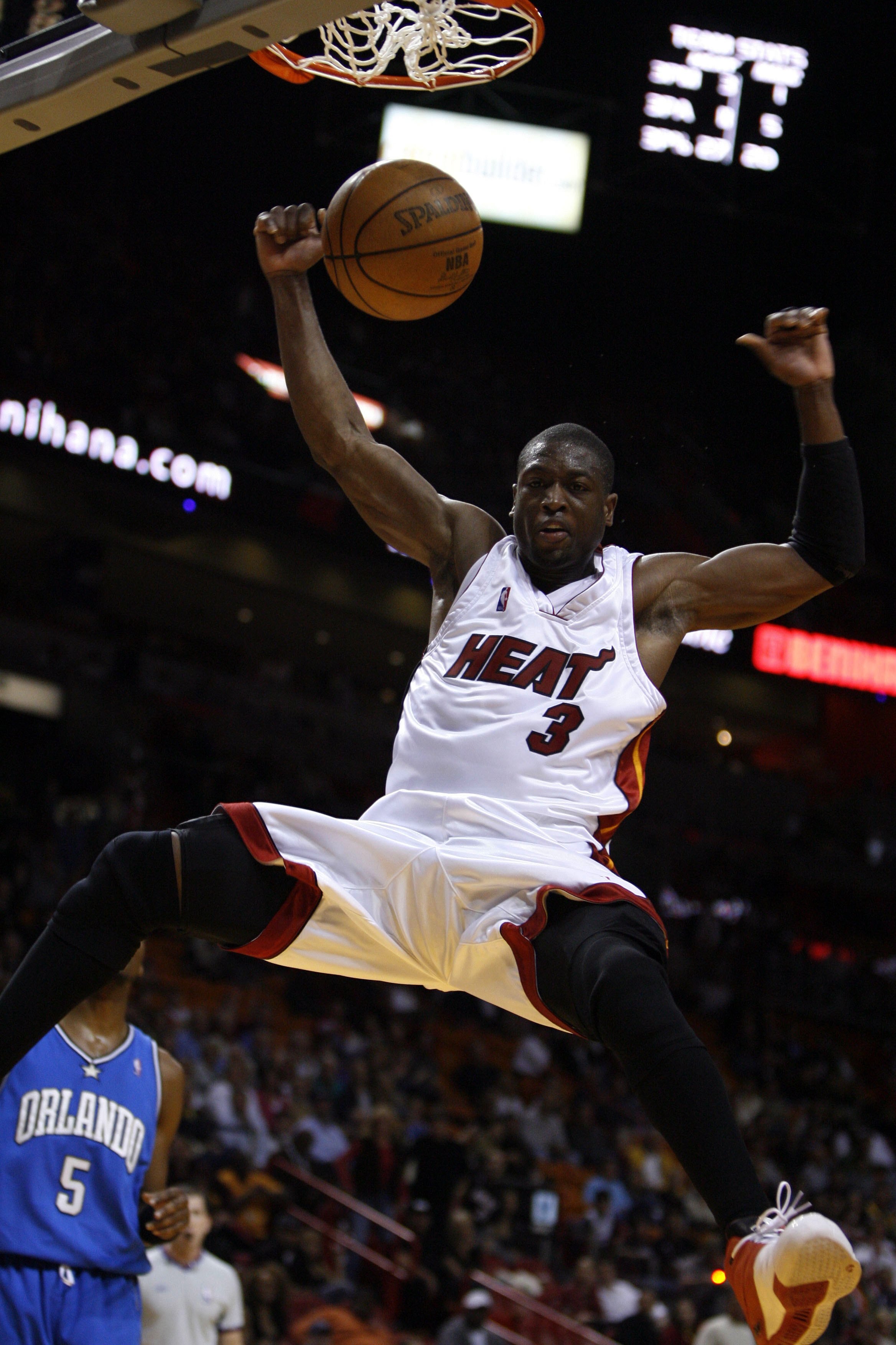 MIAMI - FEBRUARY 14:  Dwyane Wade #3 of the Miami Heat completes a dunk against the Orlando Magic February 14, 2006 at the American Airlines Arena in Miami  Florida. NOTE TO USER: User expressly acknowledges and agrees that, by downloading and/or using th