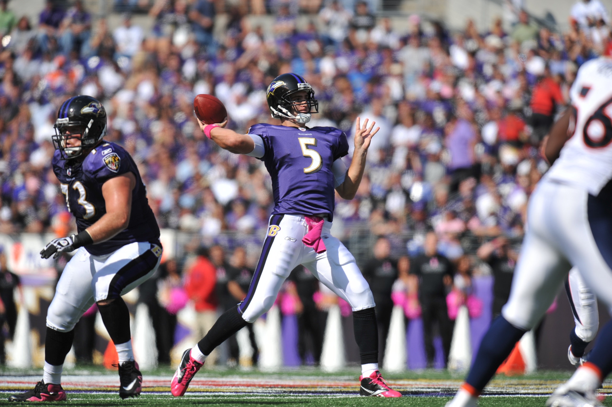 BALTIMORE, MD - OCTOBER 10:  Joe Flacco #5 of the Baltimore Ravens passes against the Denver Broncos at M&T Bank Stadium on October 10, 2010 in Baltimore, Maryland. Players wore pink in recognition of Breast Cancer Awareness Month. The Ravens defeated the